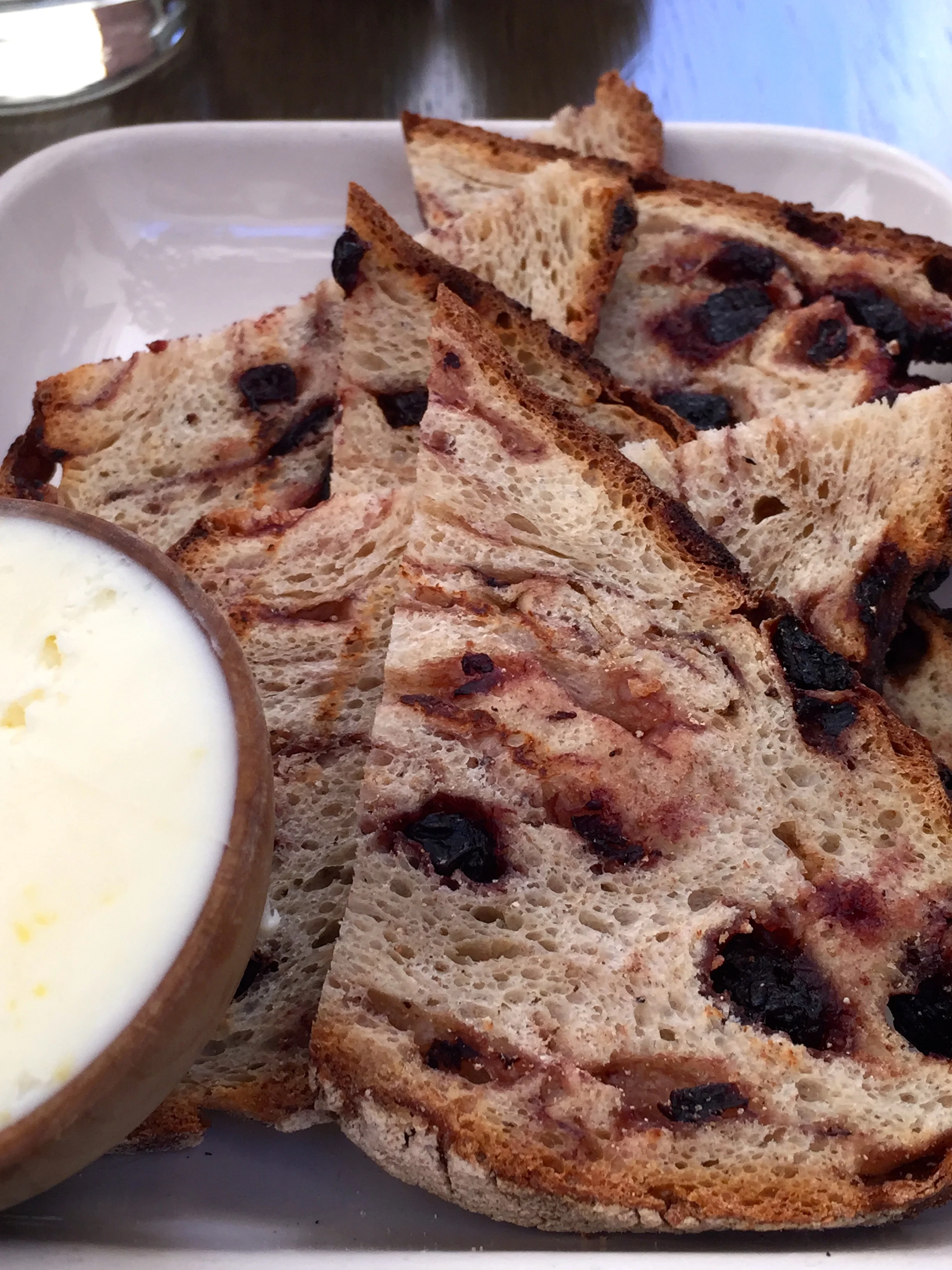 Grilled blueberry bread with lemon butter.