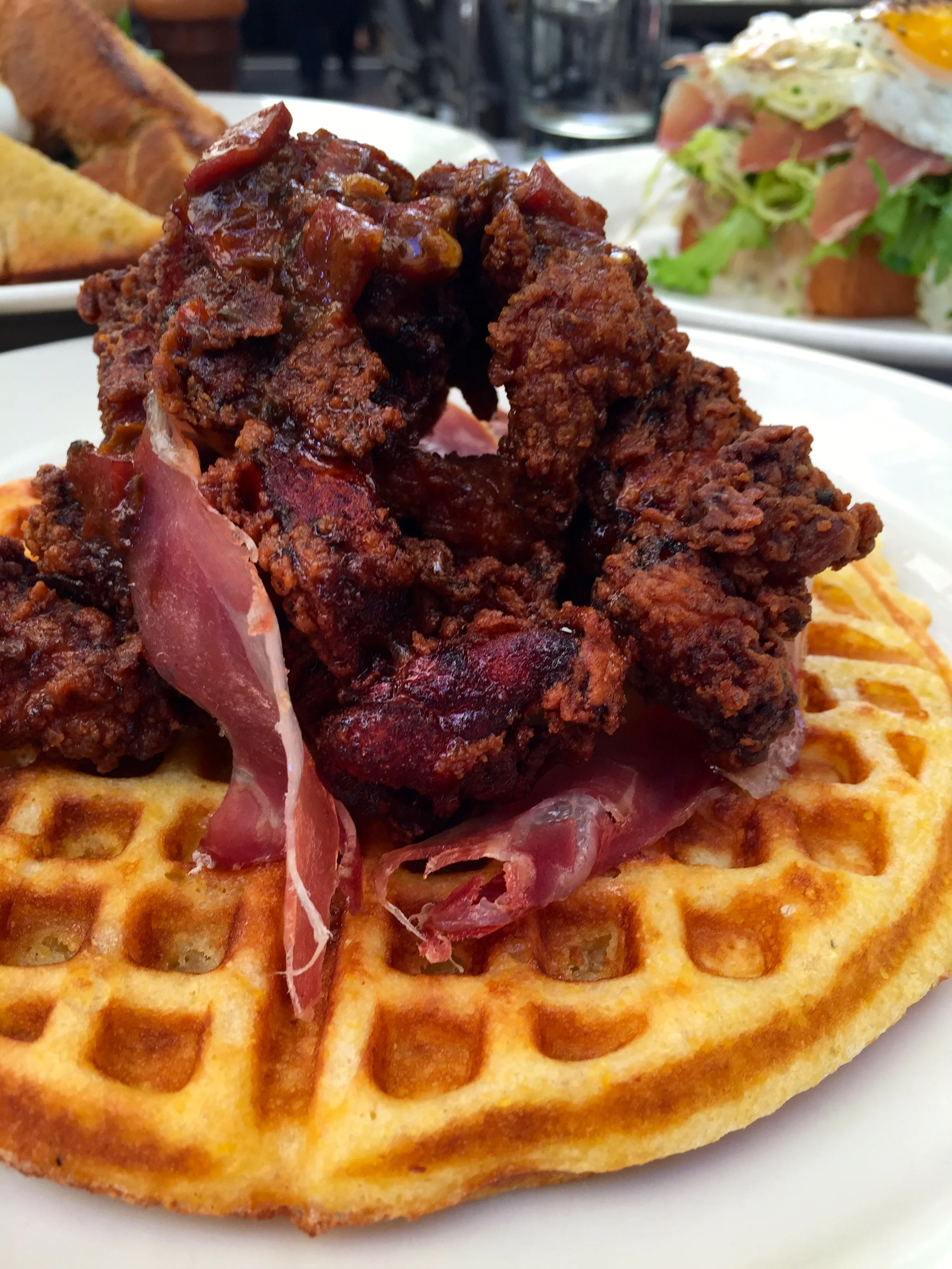 Spanish fried chicken & cornmeal waffle jamon butter & maple syrup.