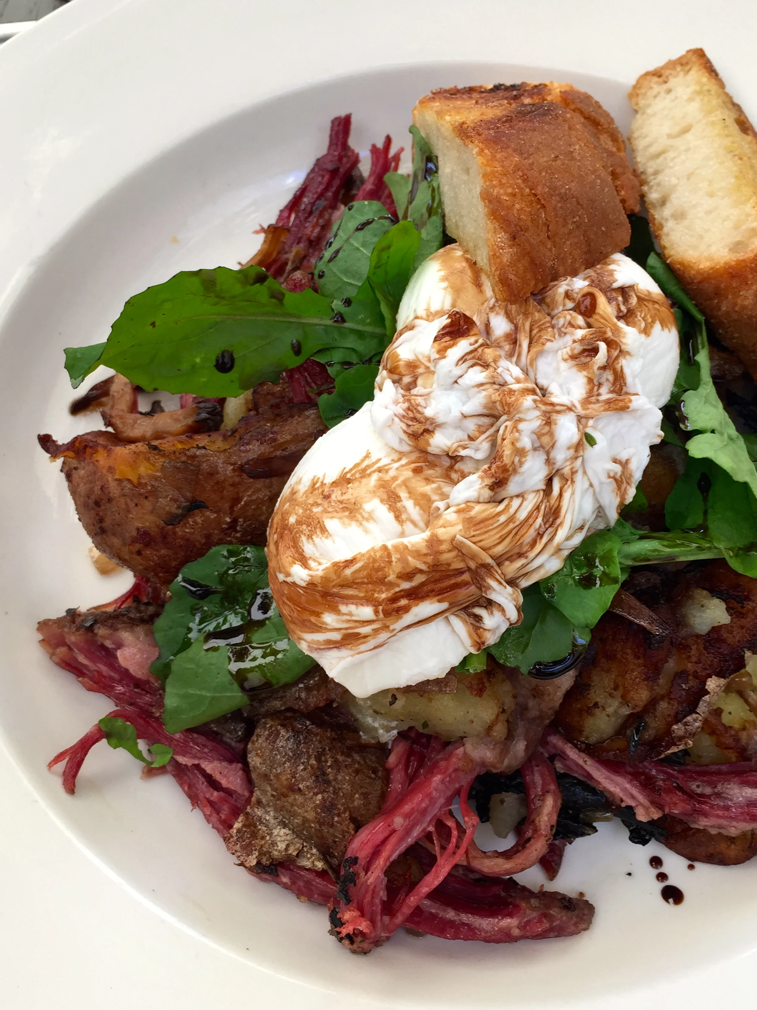House-made corned beef hash wild mushrooms & poached eggs.
