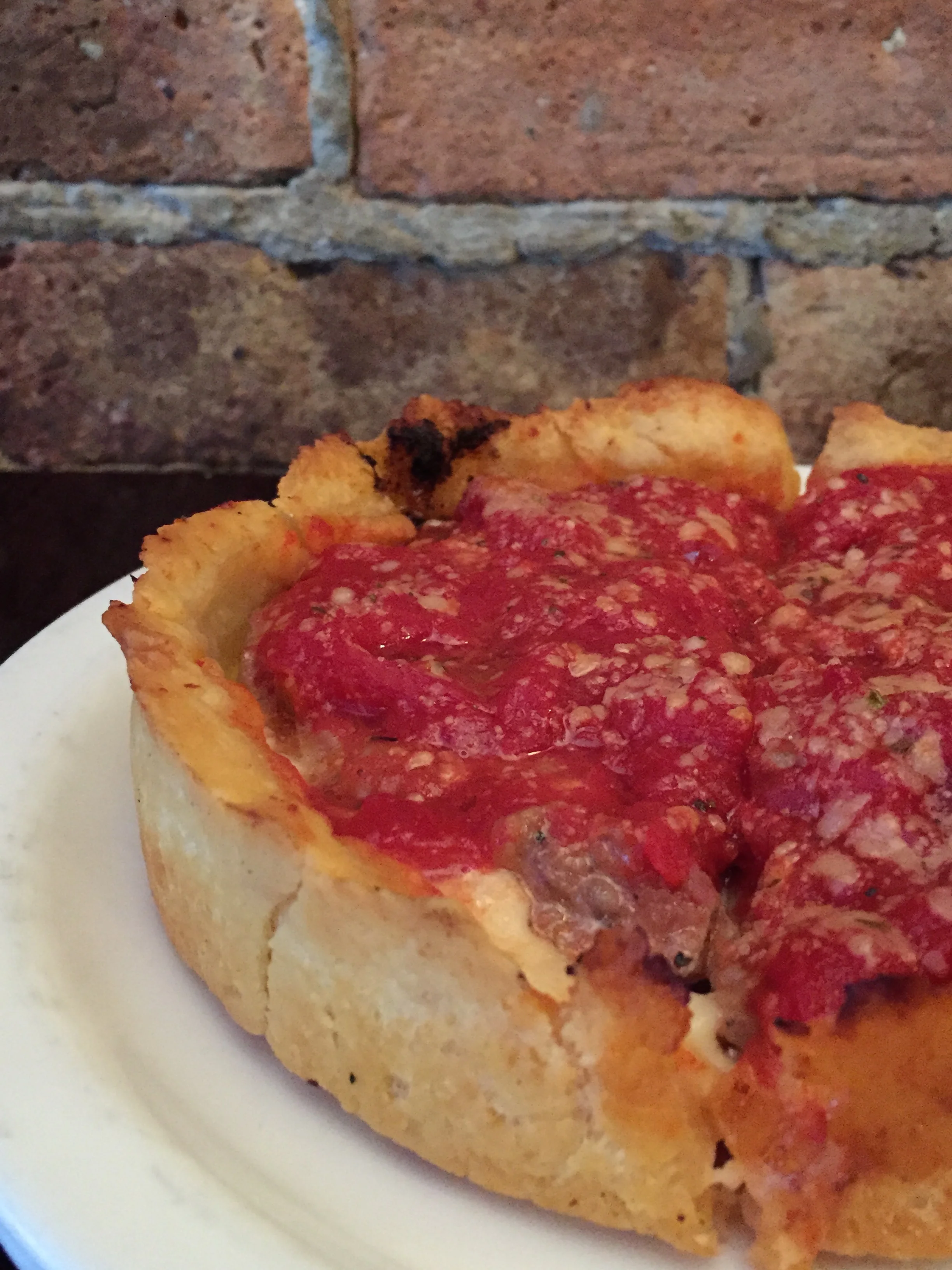 Lou Malnati's - The Malnati Chicago Classic™, made with Lou's lean sausage, some extra cheese and vine-ripened tomato sauce on Buttercrust.™