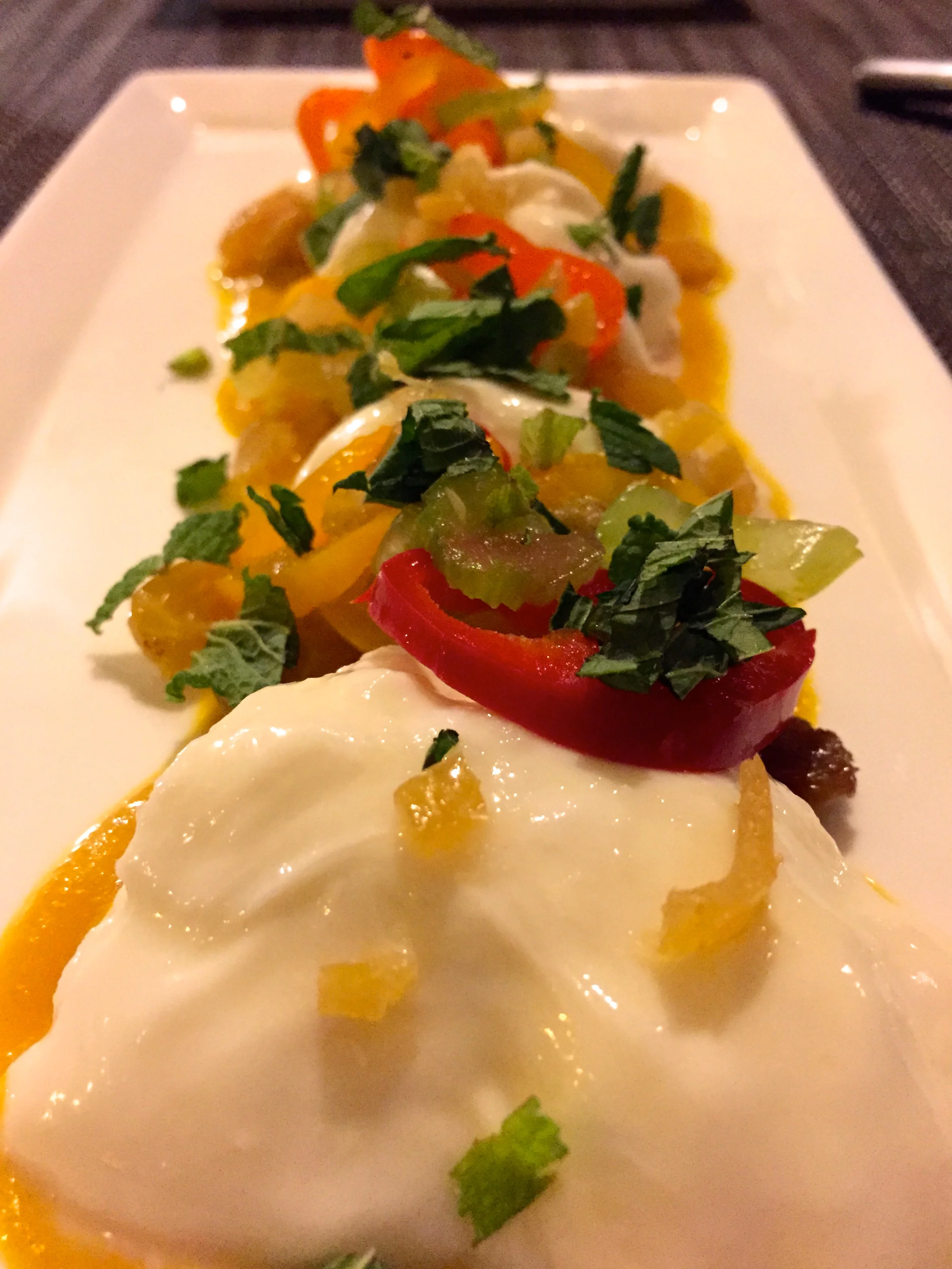 Green Zebra - Burrata alla Pann with,Moroccan-spiced carrot puree, golden raisins, and compressed baby sweet peppers.