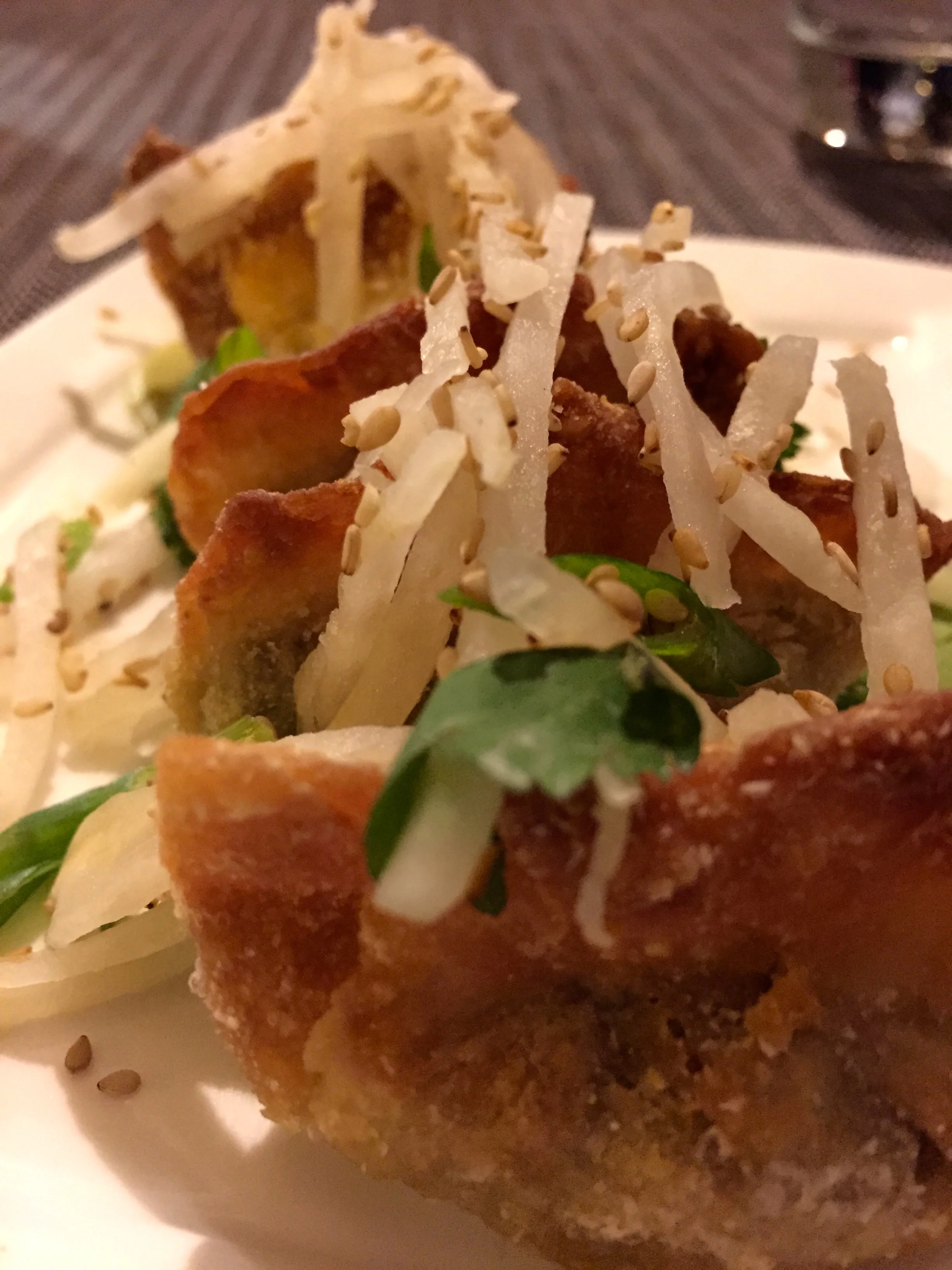 Green Zebra - Adzuki Bean Potstickers with Haas avocado, ponzu puree, daikon radish, and sesame seeds.