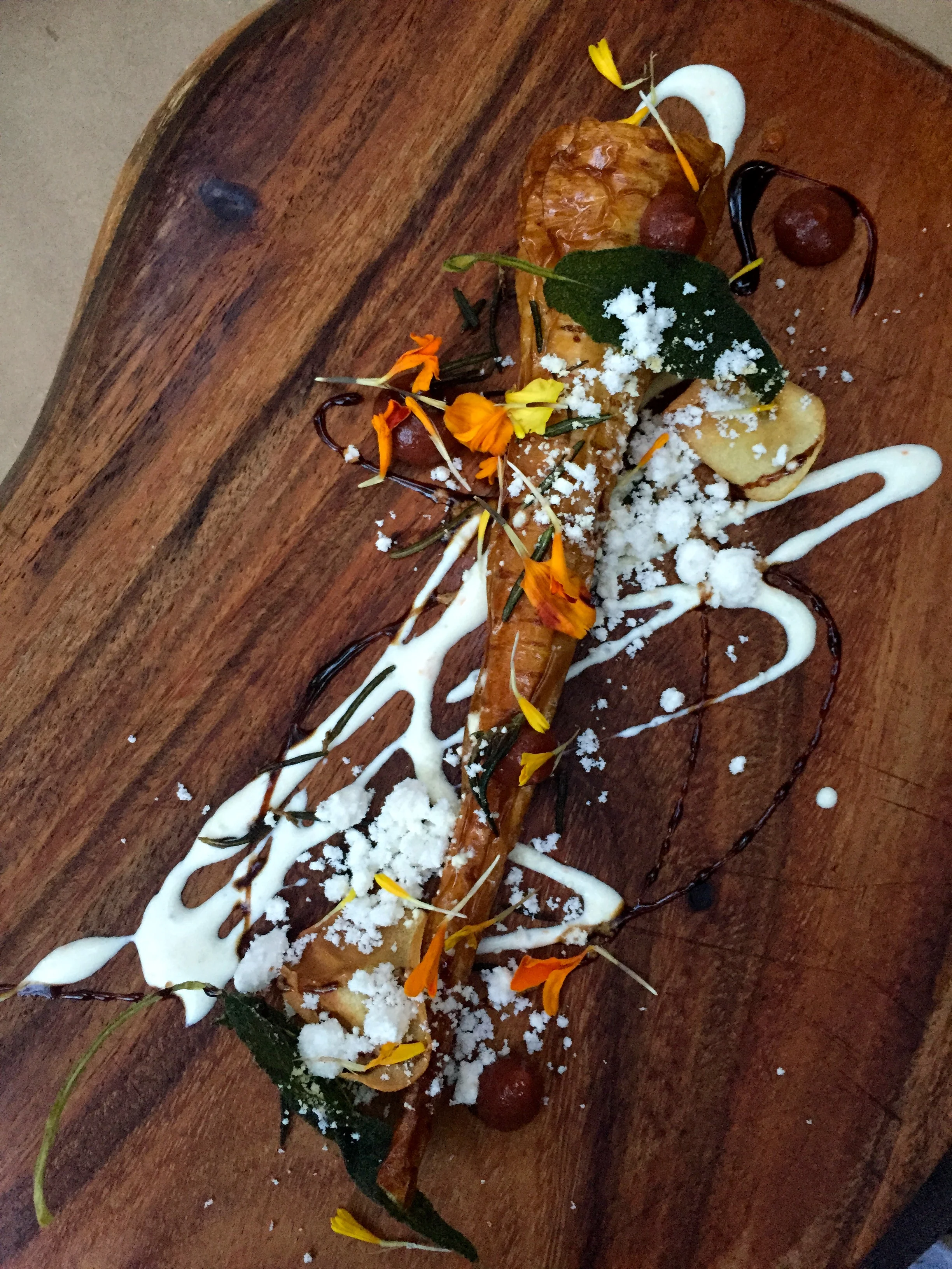 PARSNIP roasted in duck fat, date puree, creme fraiche, spiced vinaigrette, and fresh and crisp herbs.
