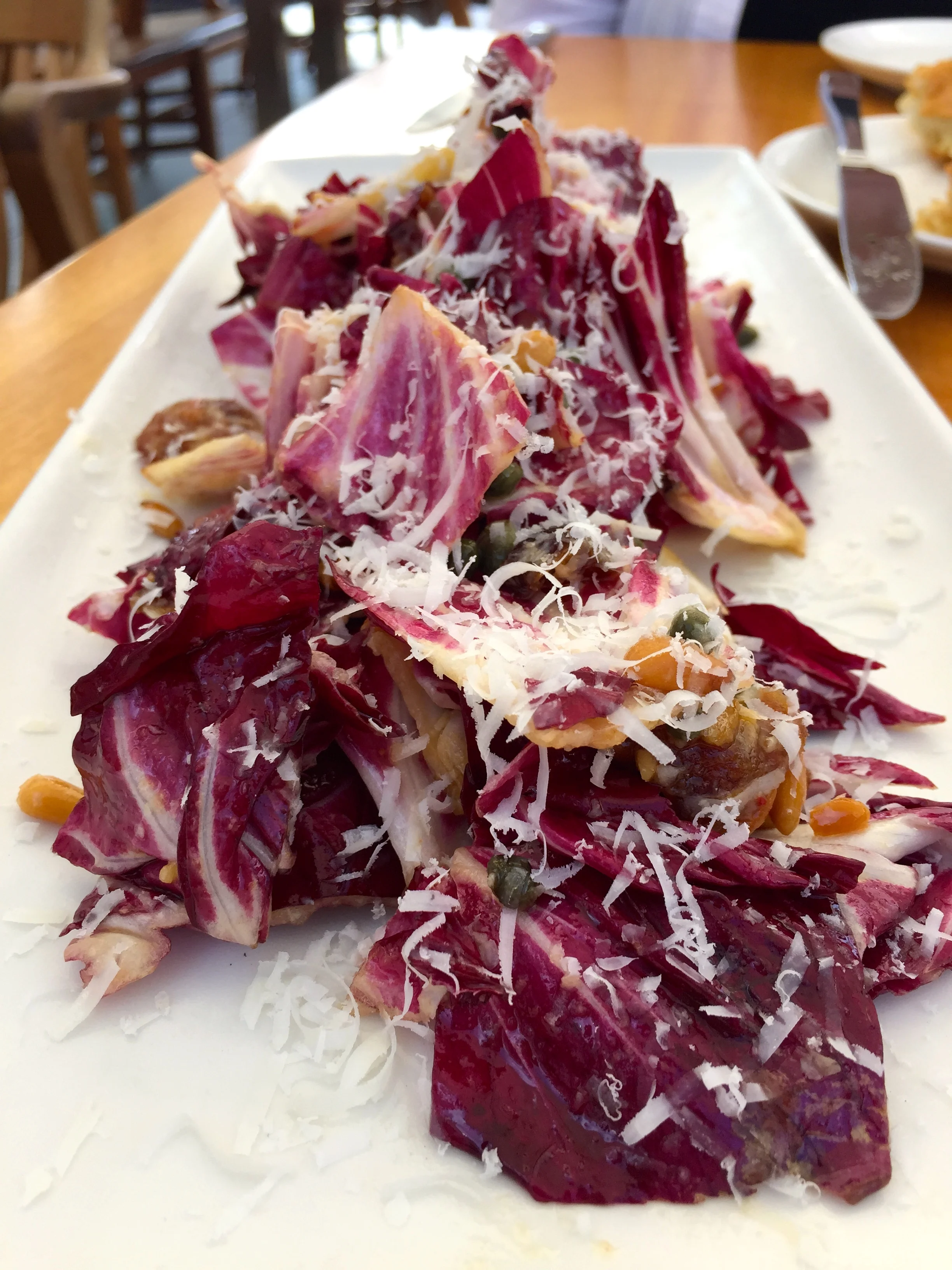 Verona Radicchio, honey dates, pine nuts, capers, bagna cauda, pecorino and sardo.