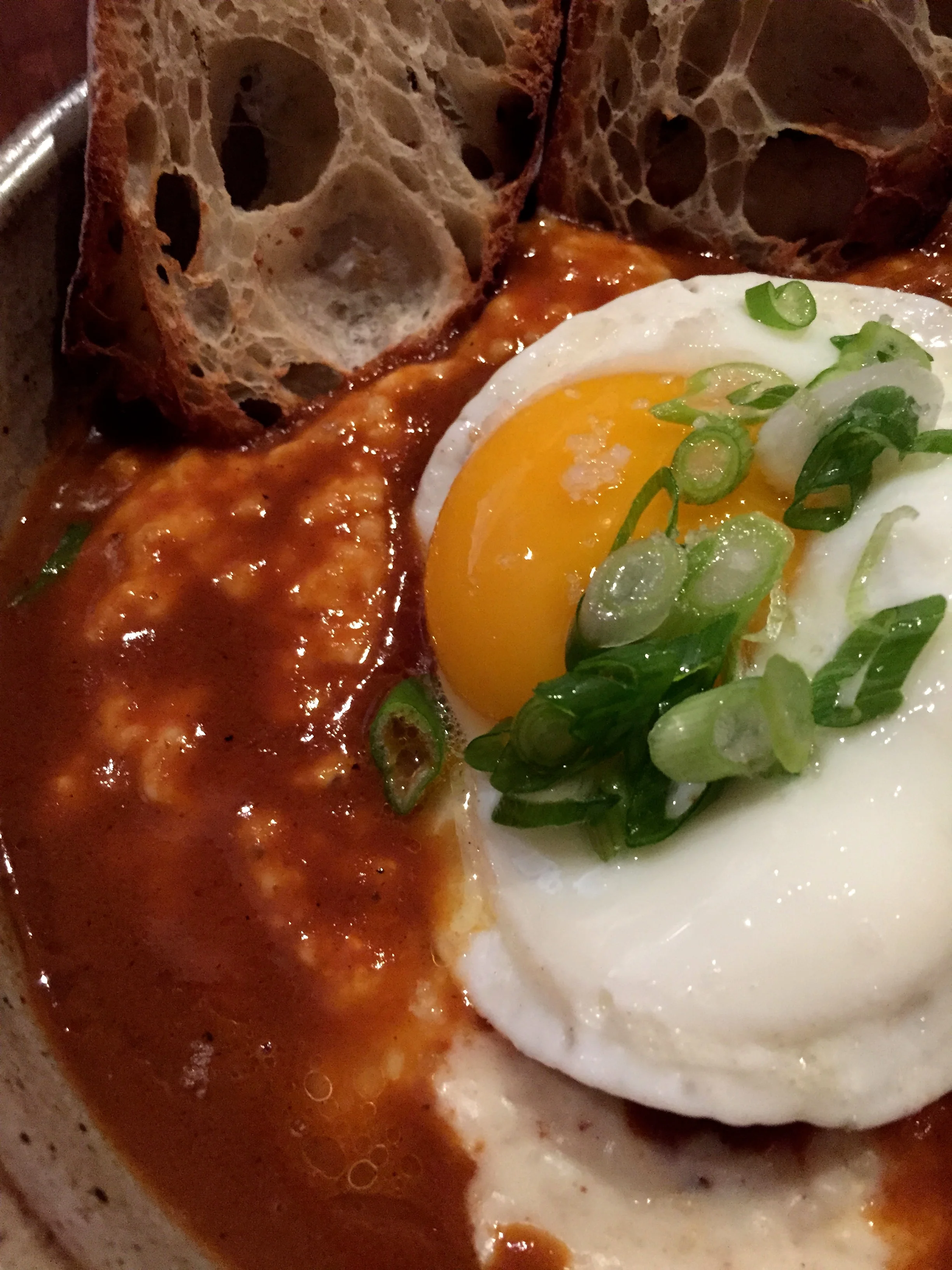 Shrimp and cheddar grits, chipotle, a fried egg, and toast.