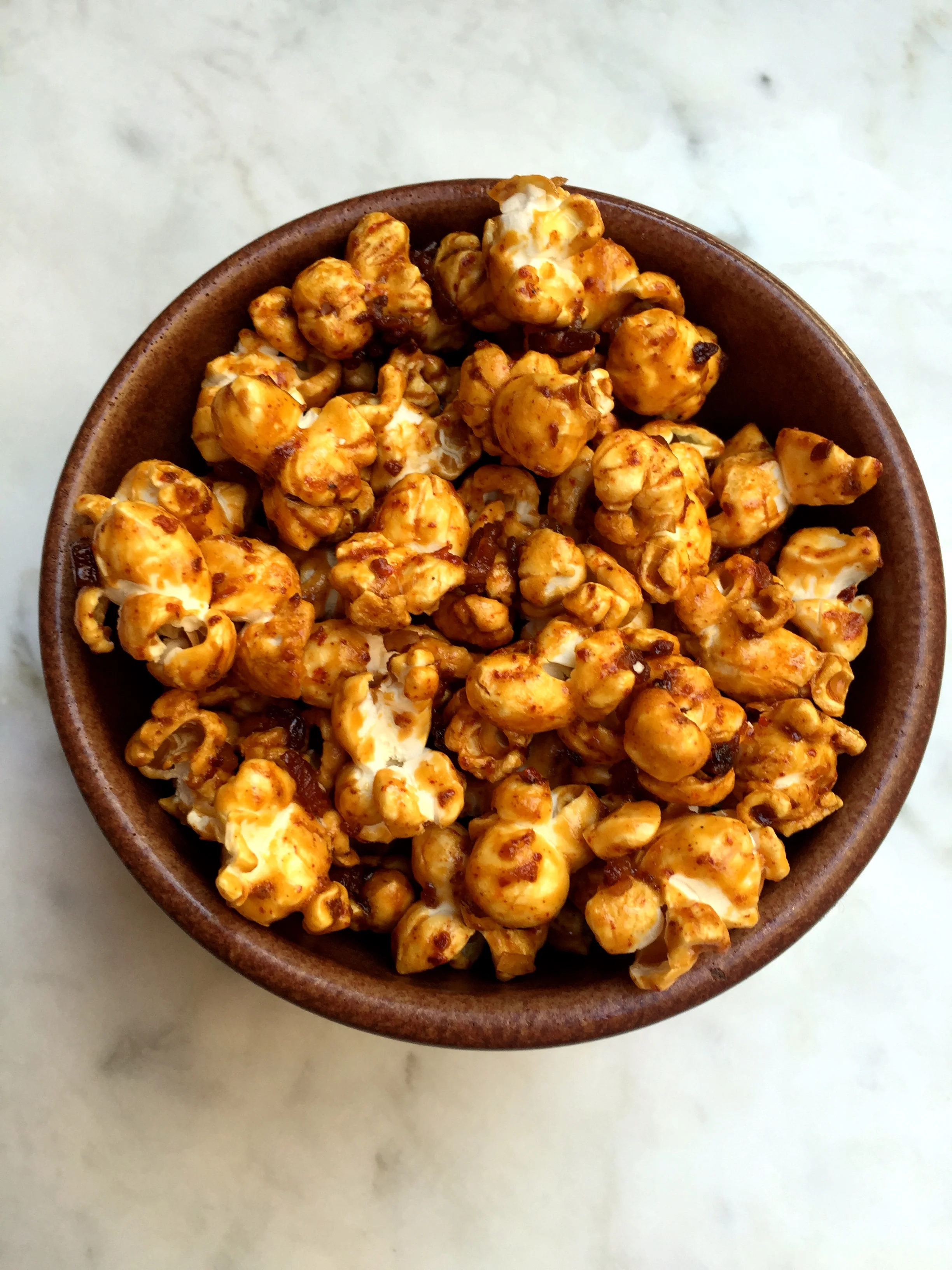 Popped corn, crisp bacon, brown sugar, chili.