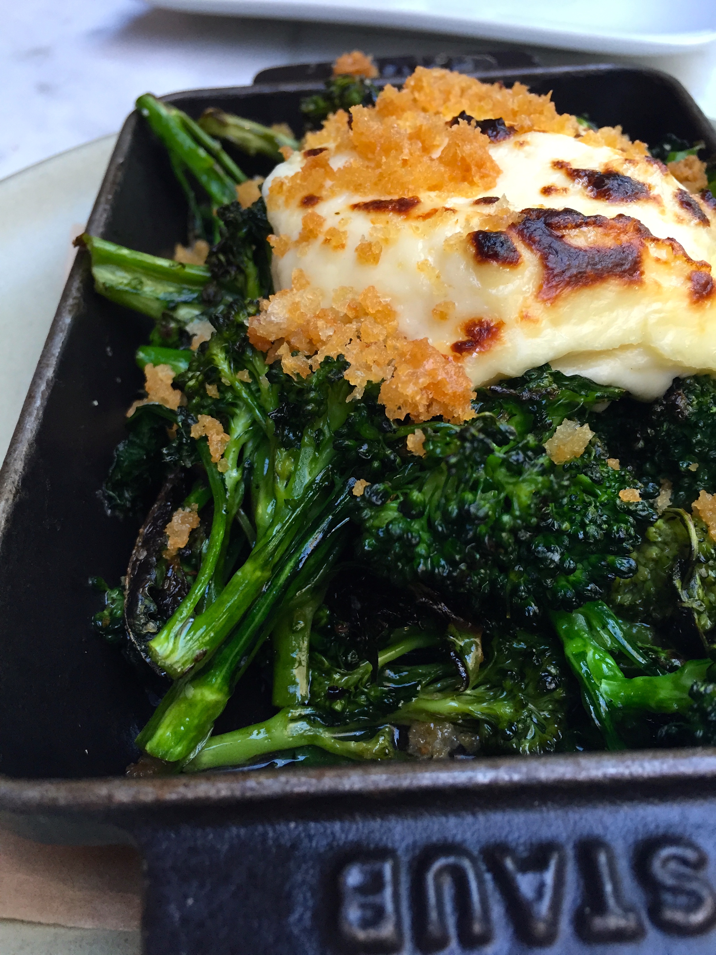Baby broccoli parmesan pudding breadcrumb chili flake.