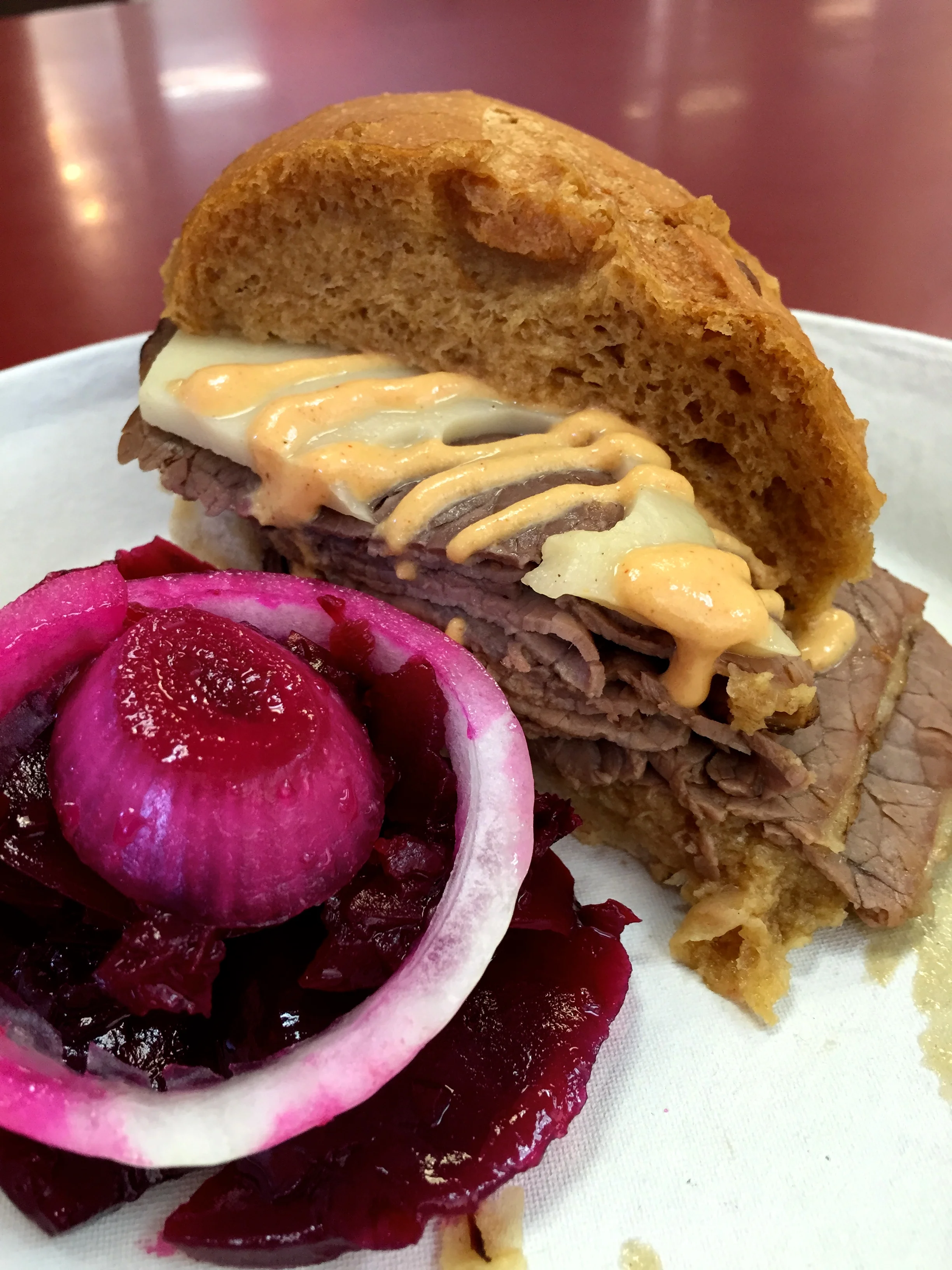 Beef Dip with Swiss cheese, Philippe's hot mustard, and pickled beet salad.