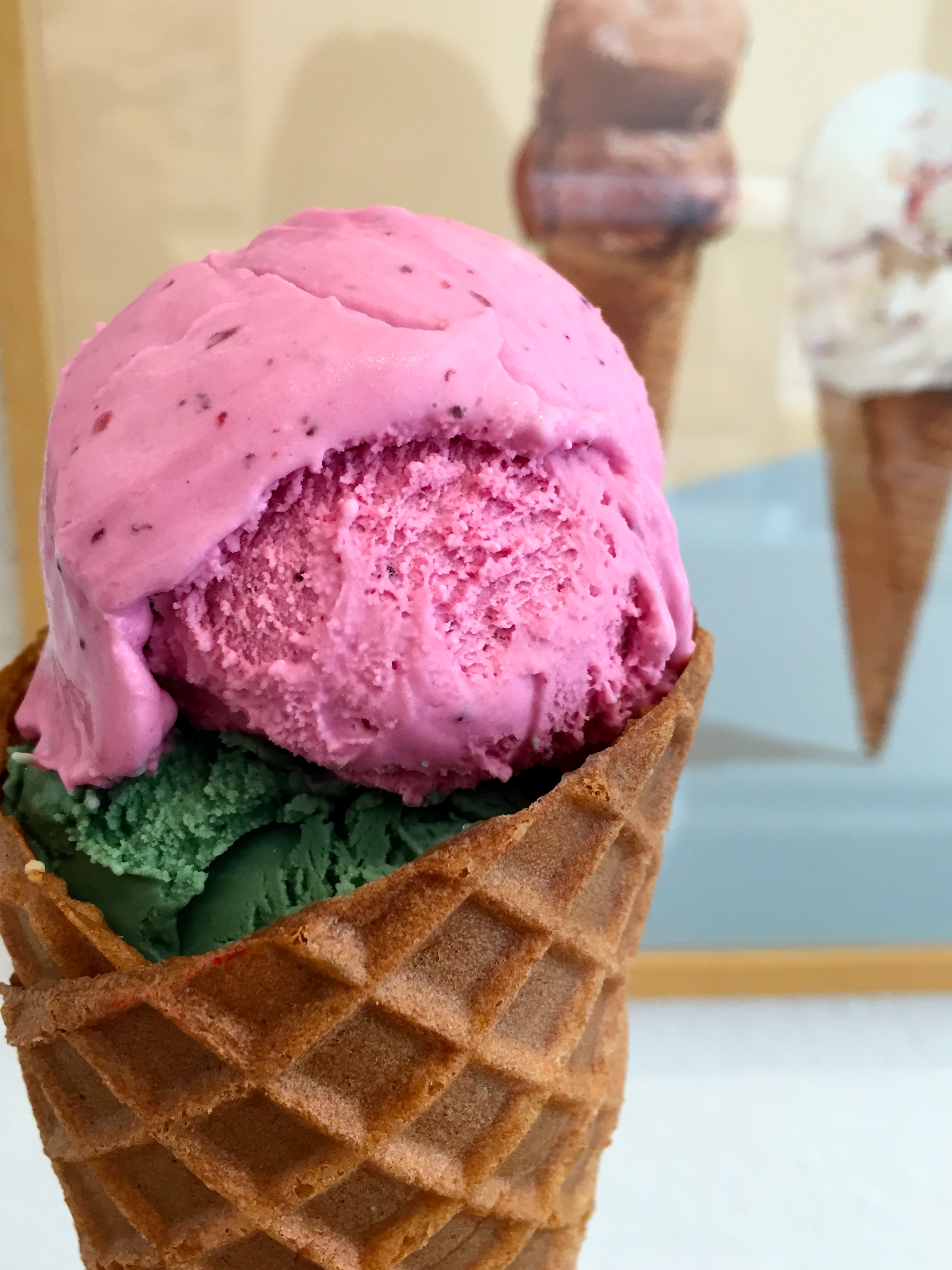 Top scoop: “Ultramarine Blue Buttermilk” with pulverized wild Maine blueberries and natural fruit extracts with buttermilk, biodynamic yogurt, grass-grazed milk, and cream. Bottom scoop: “Garance Vert Clair” with lemongrass, coriander leaf, spirulina, grass-grazed milk, and cream.