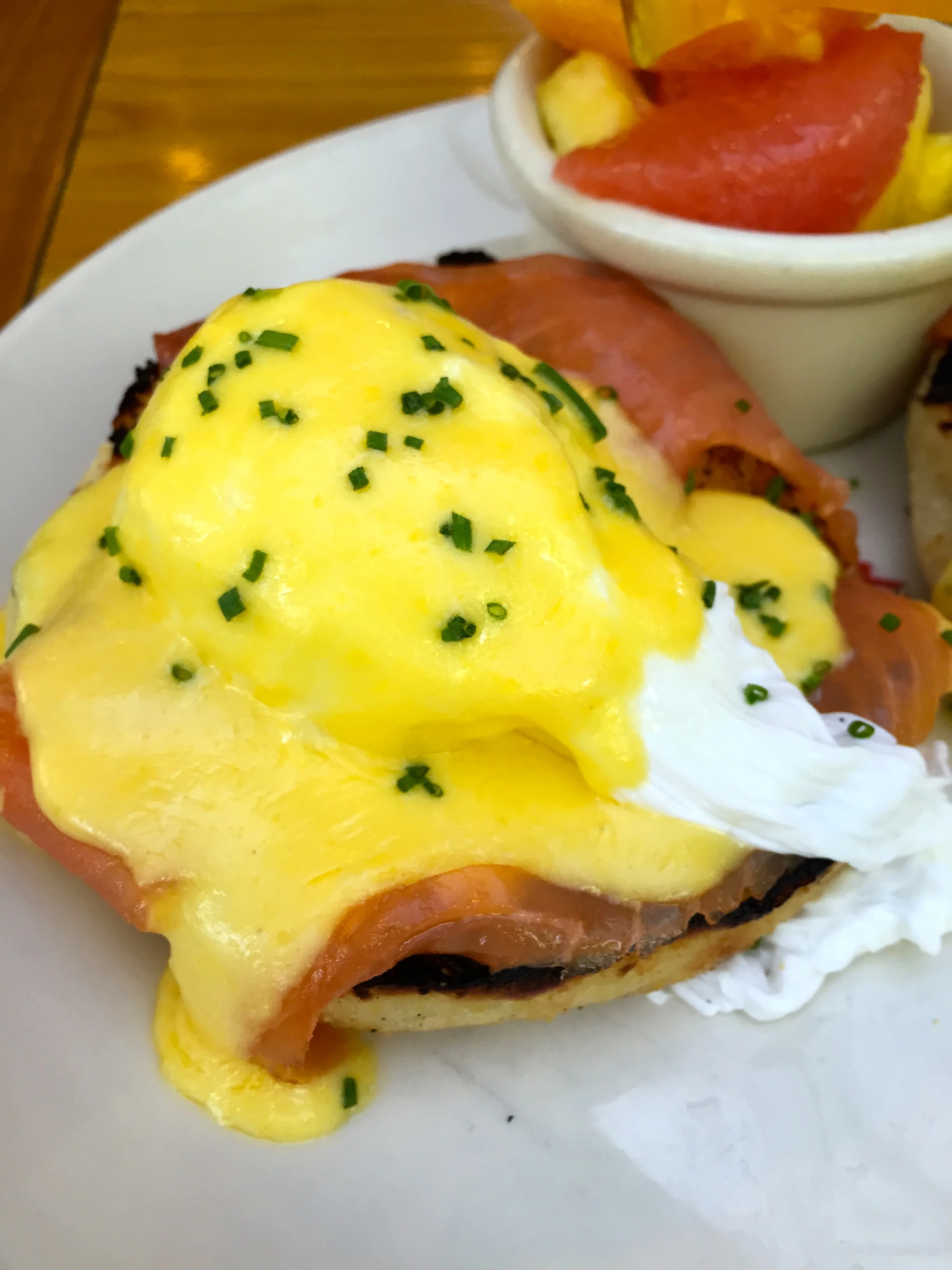 SMOKED SALMON BENEDICT poached eggs, hollandaise, english muffin, fruit.