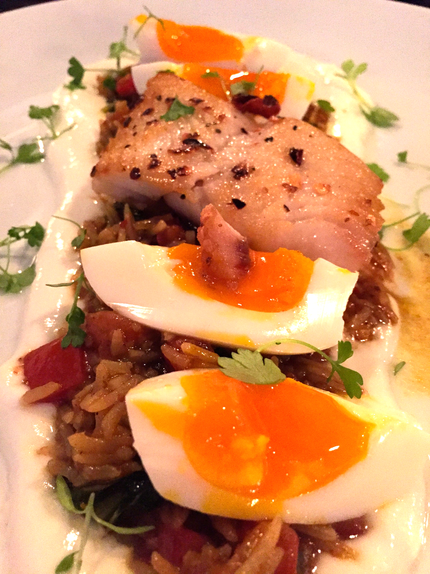 Curried Rice and Cod, curried basmati rice, beet greens served with a quartered 8 minute egg, salt cod and yoghurt.