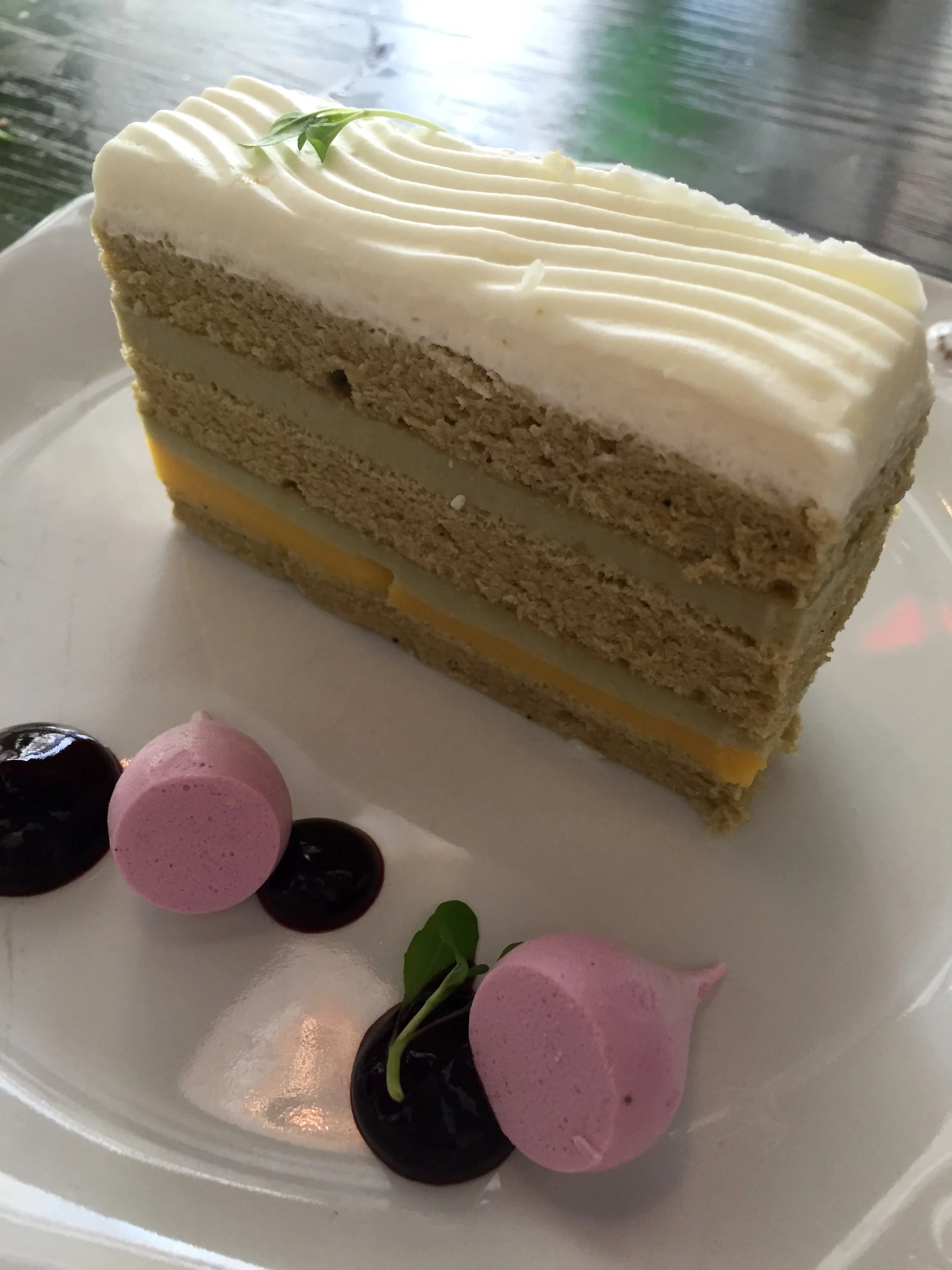 Matcha Green Tea Cake with passion fruit curd and huckleberry meringues.