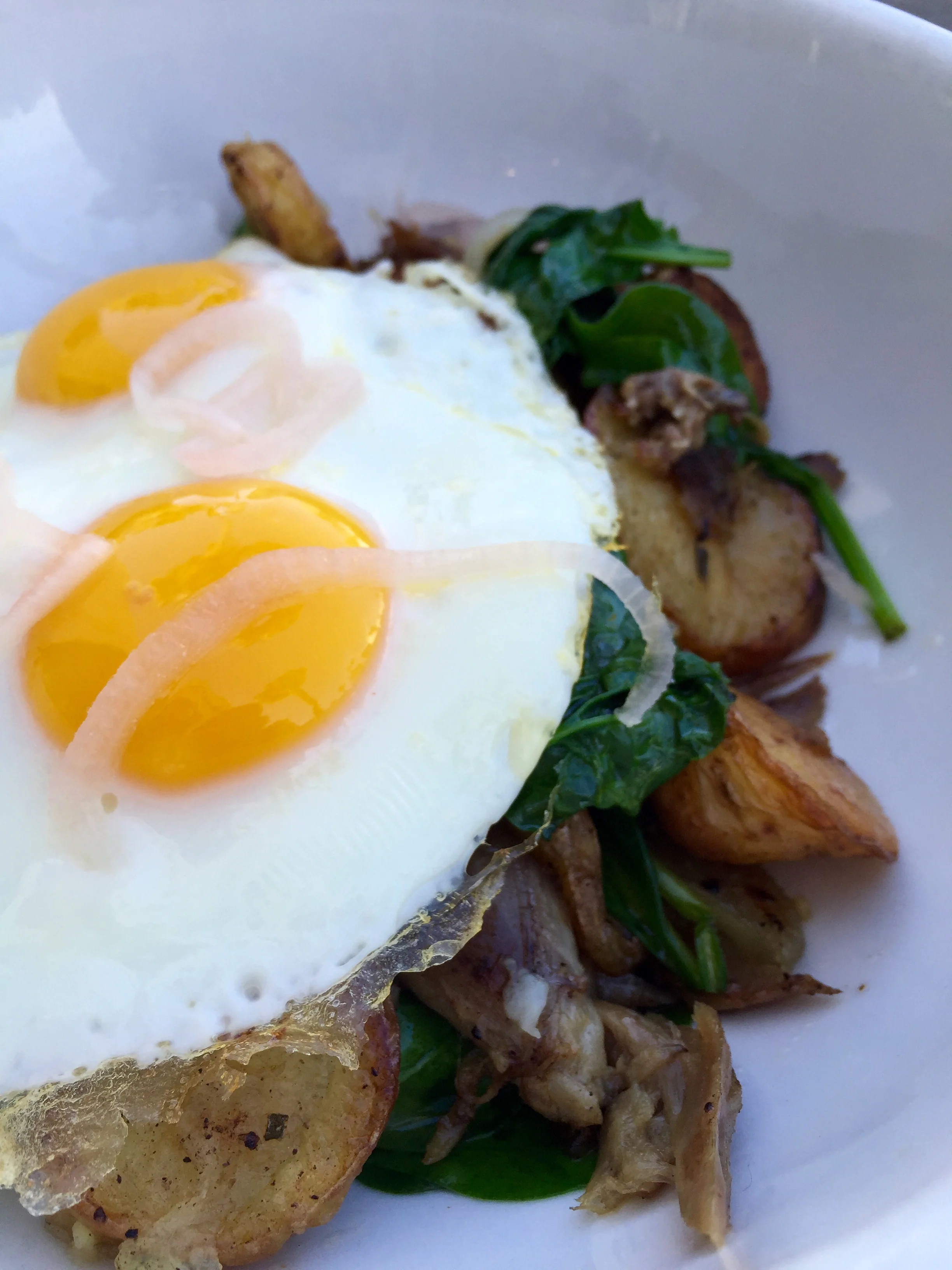Duck Confit hash with Weiser Farm’s roasted potatoes, shallots, spinach & sunny-side up eggs.