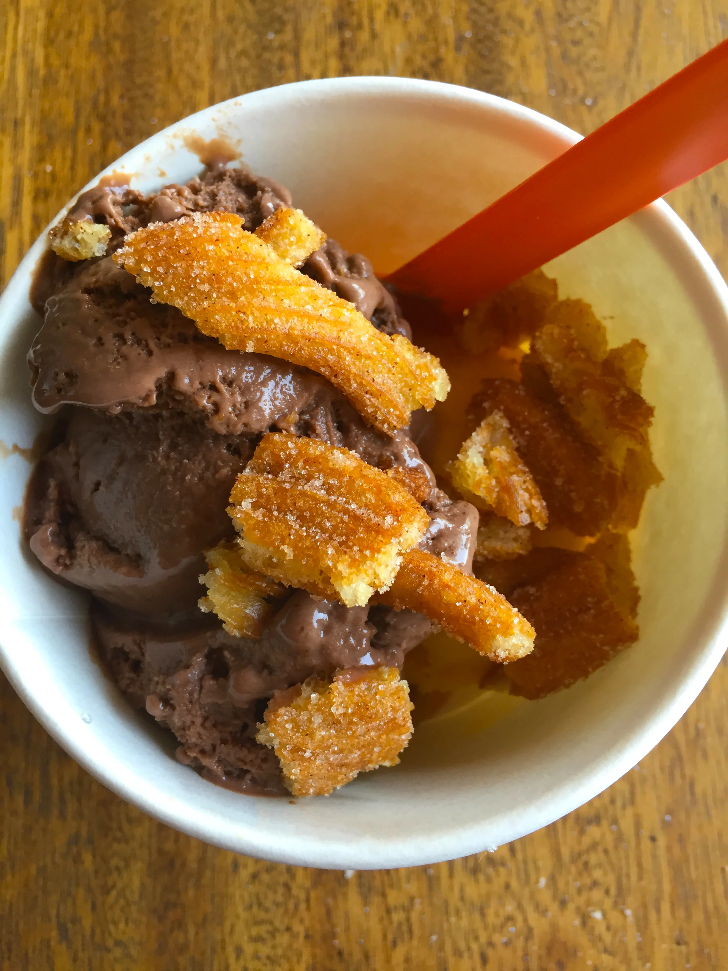 Spicy hot chocolate + Tangelo kumquat sorbet, topped with churro bits.