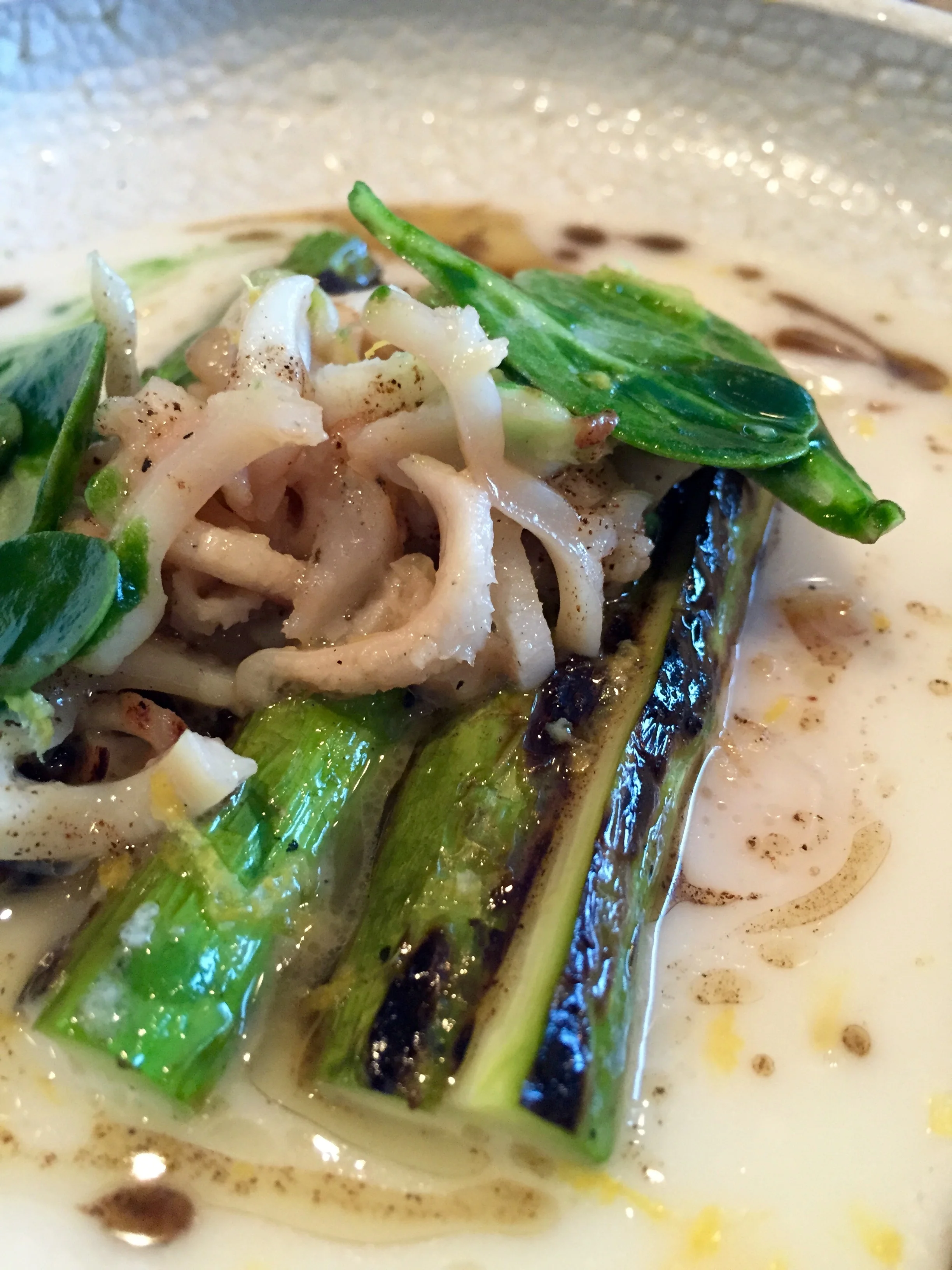Charred California asparagus, parmesan broth, razor clams, and black pepper.