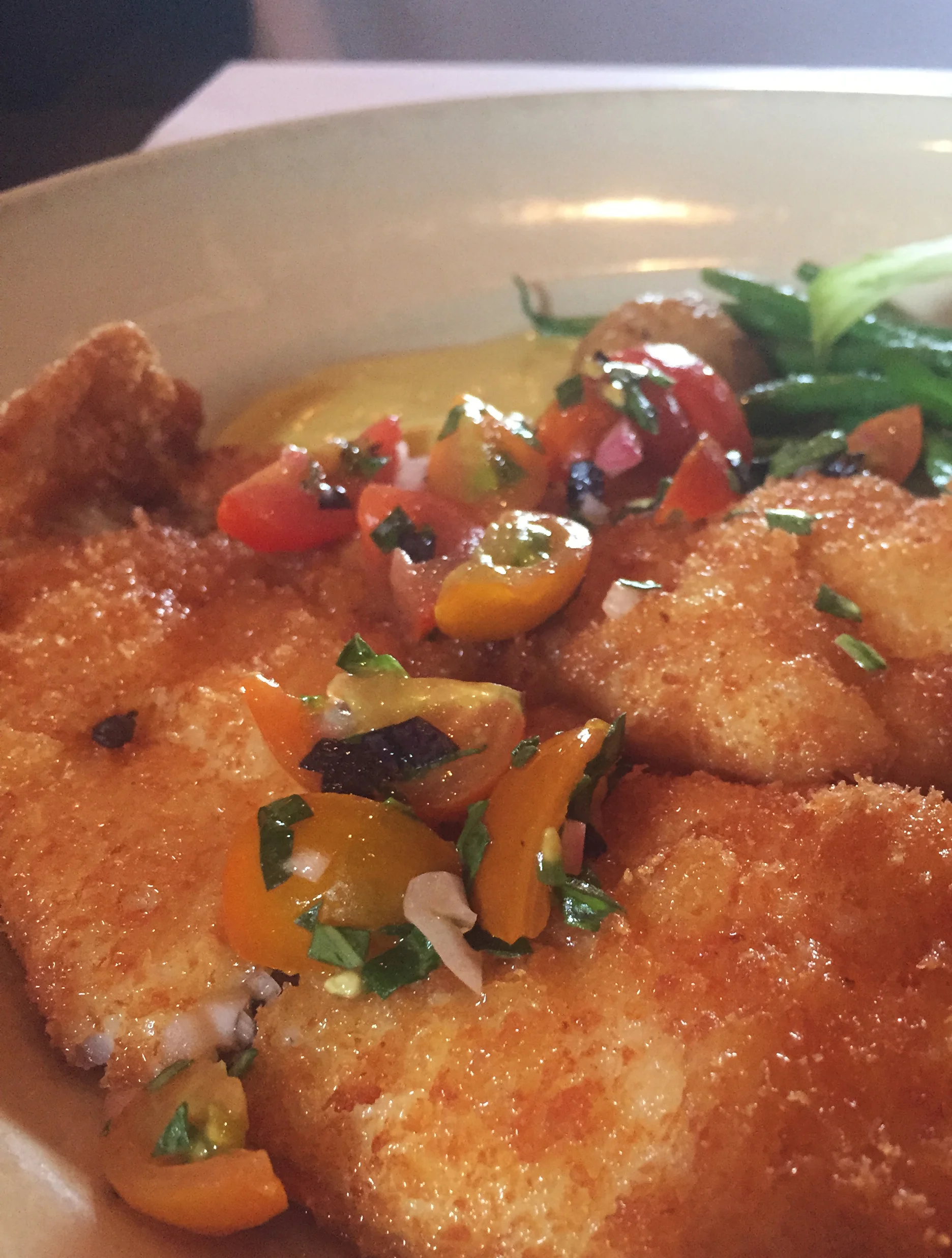 Fried petrale sole with cherry tomatoes, green beans, potatoes, and aioli.