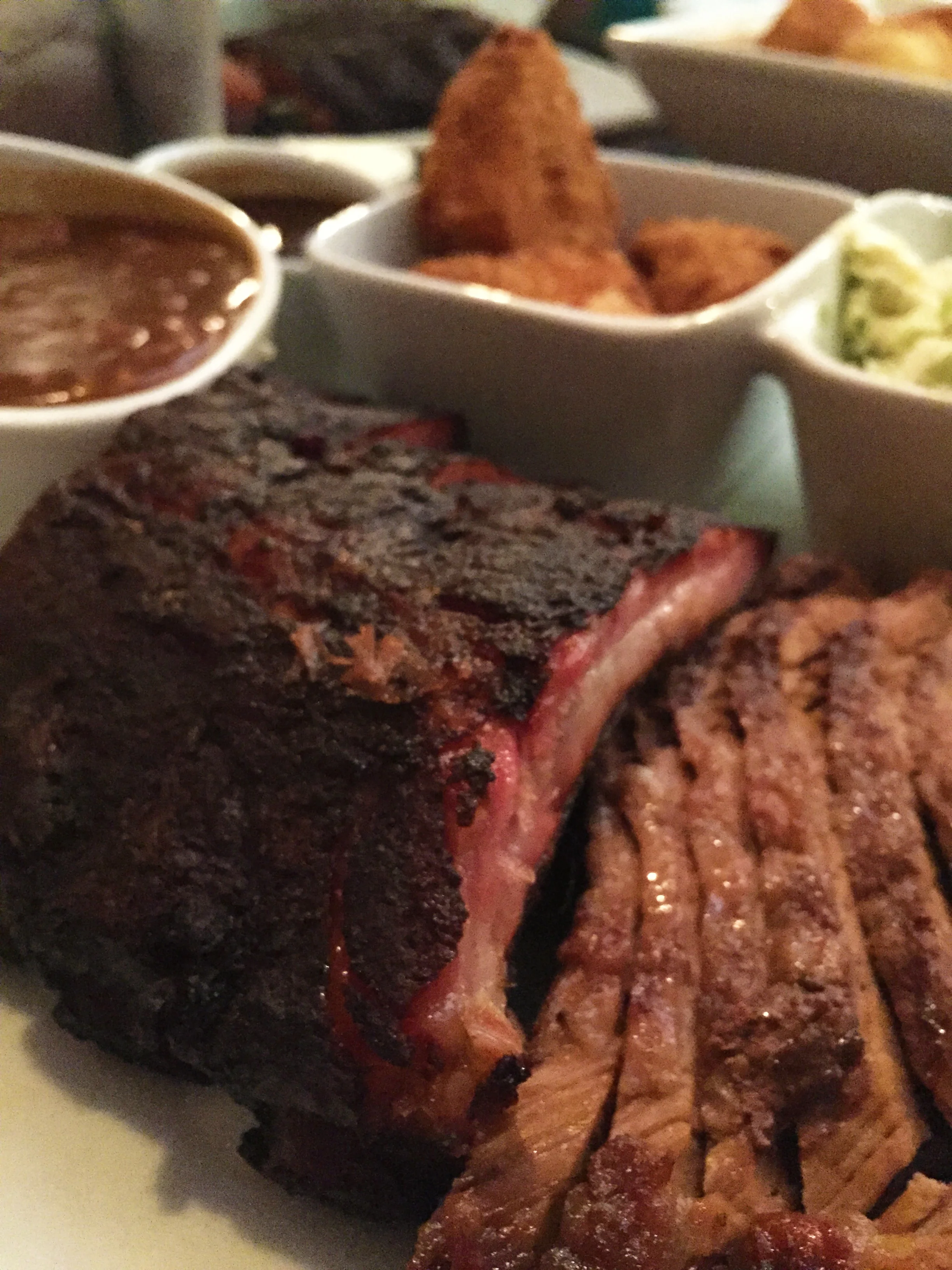 Left: Slow hickory smoked pork baby back ribs. Right: Smoked brisket (lean).