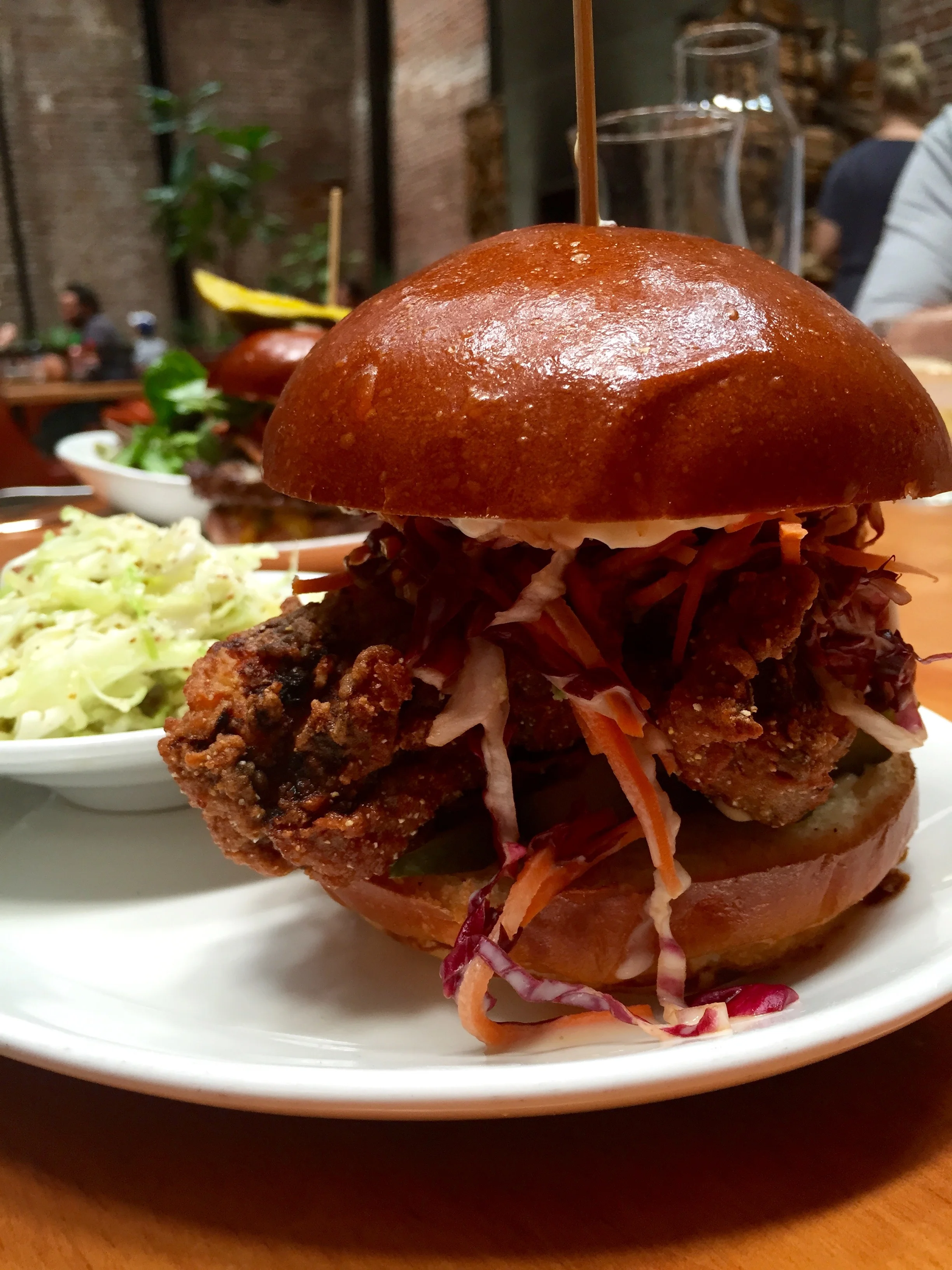 Buttermilk Fried Chicken Sandwich with radicchio slaw, jalapeno-mustard aioli, and house made pickles.