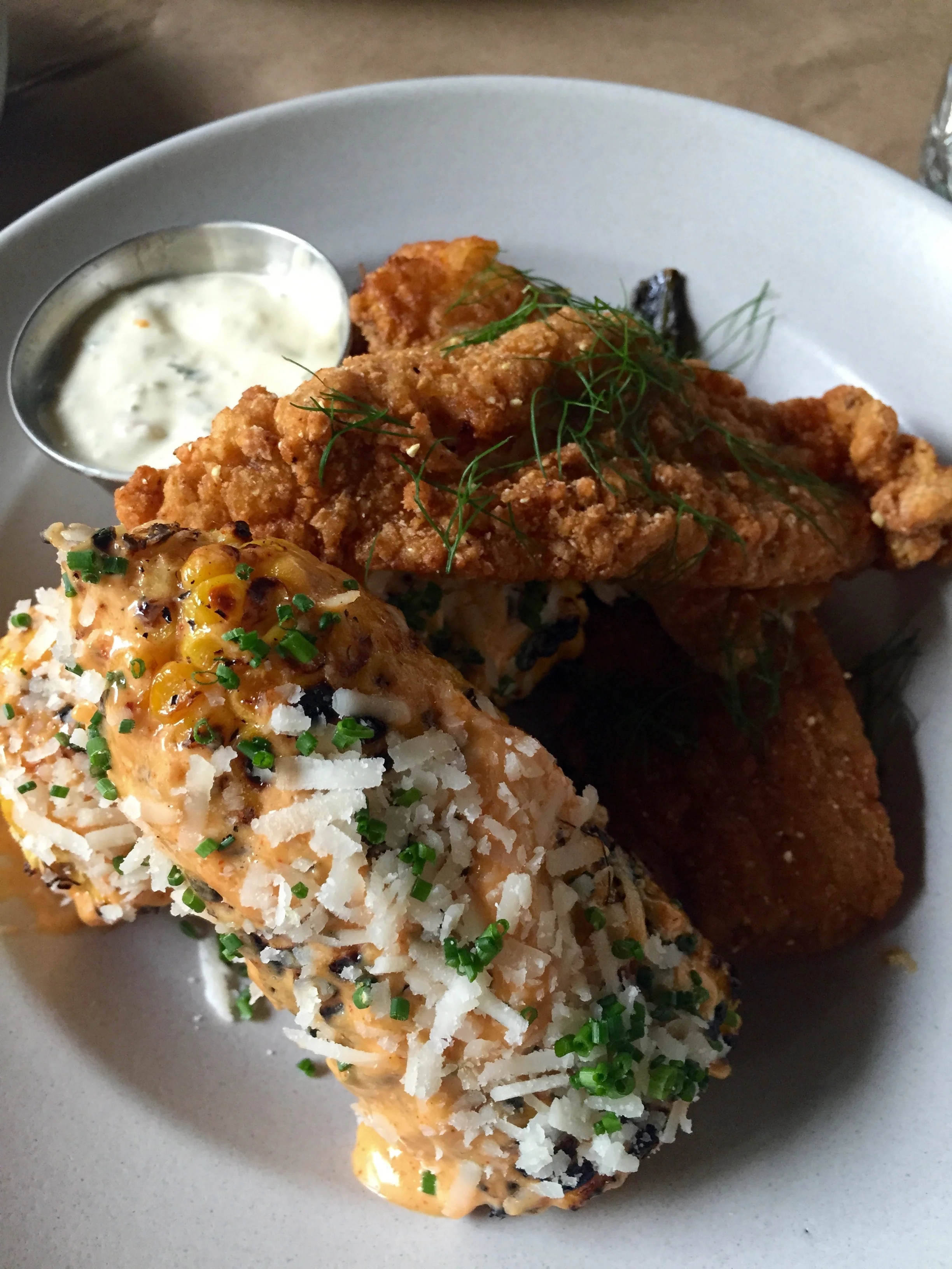 Cornmeal Crusted Catfish with grilled spicy corn and bacon tartar sauce.