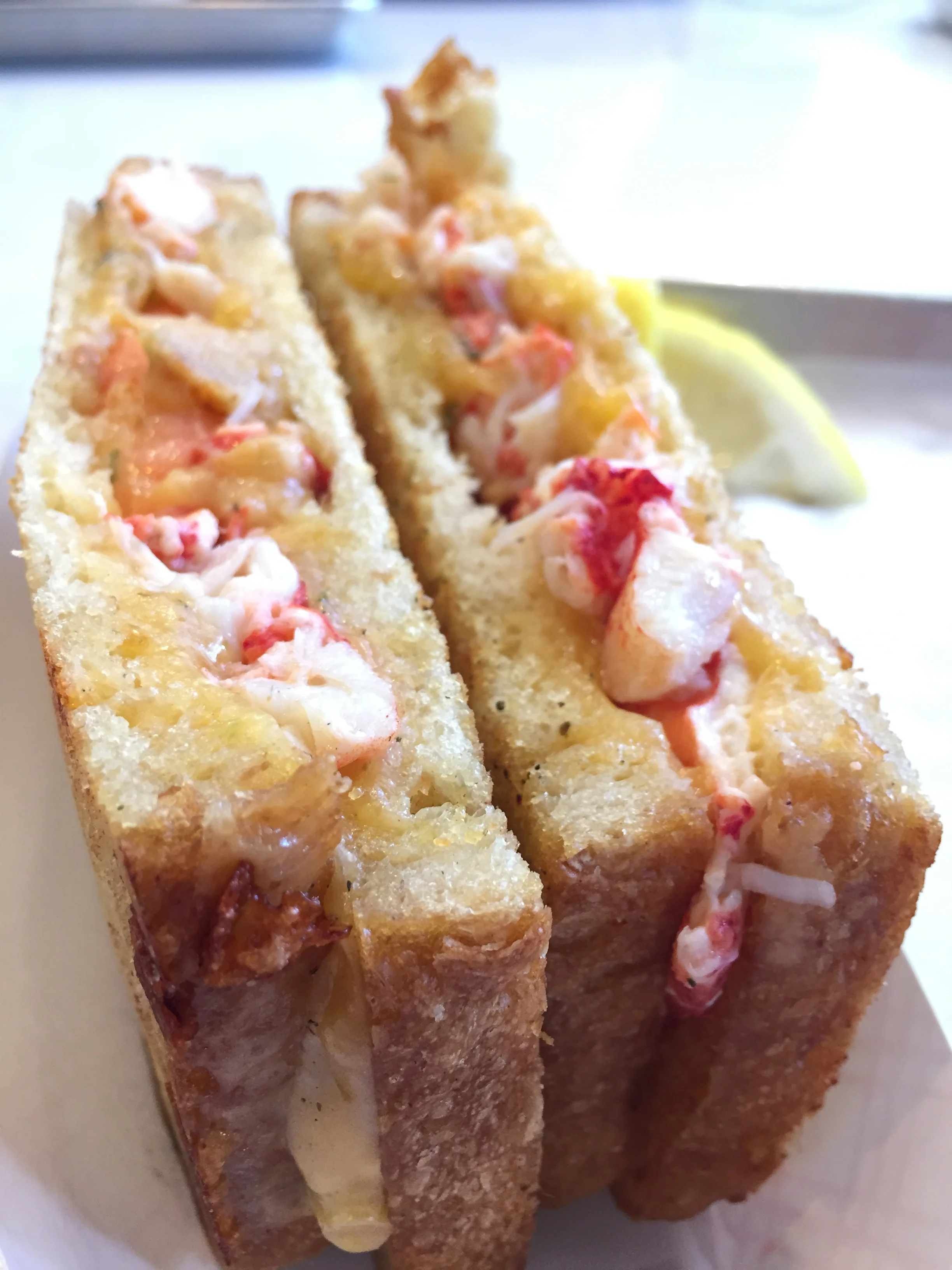 Knuckle Sandwich with freshly baked sourdough bread, 4 oz. of Cotswold Cheddar melted over a 1/4 pound of fresh Maine Lobster