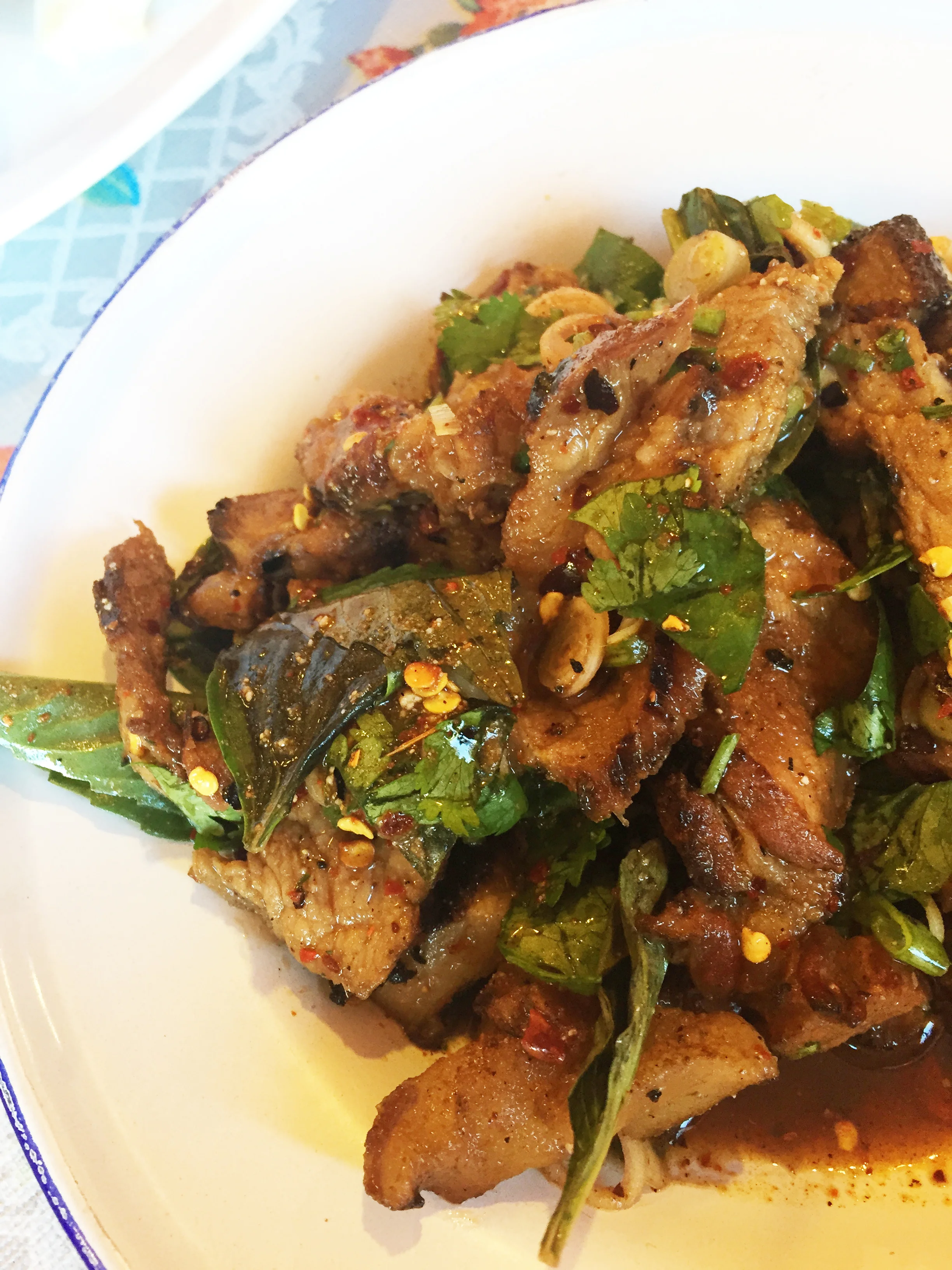 Moo Sadoong "Startled Pig" - grilled pork, basil, lemongrass, garlic, fish sauce, lime, chile, onions, cilantro, and rice powder.