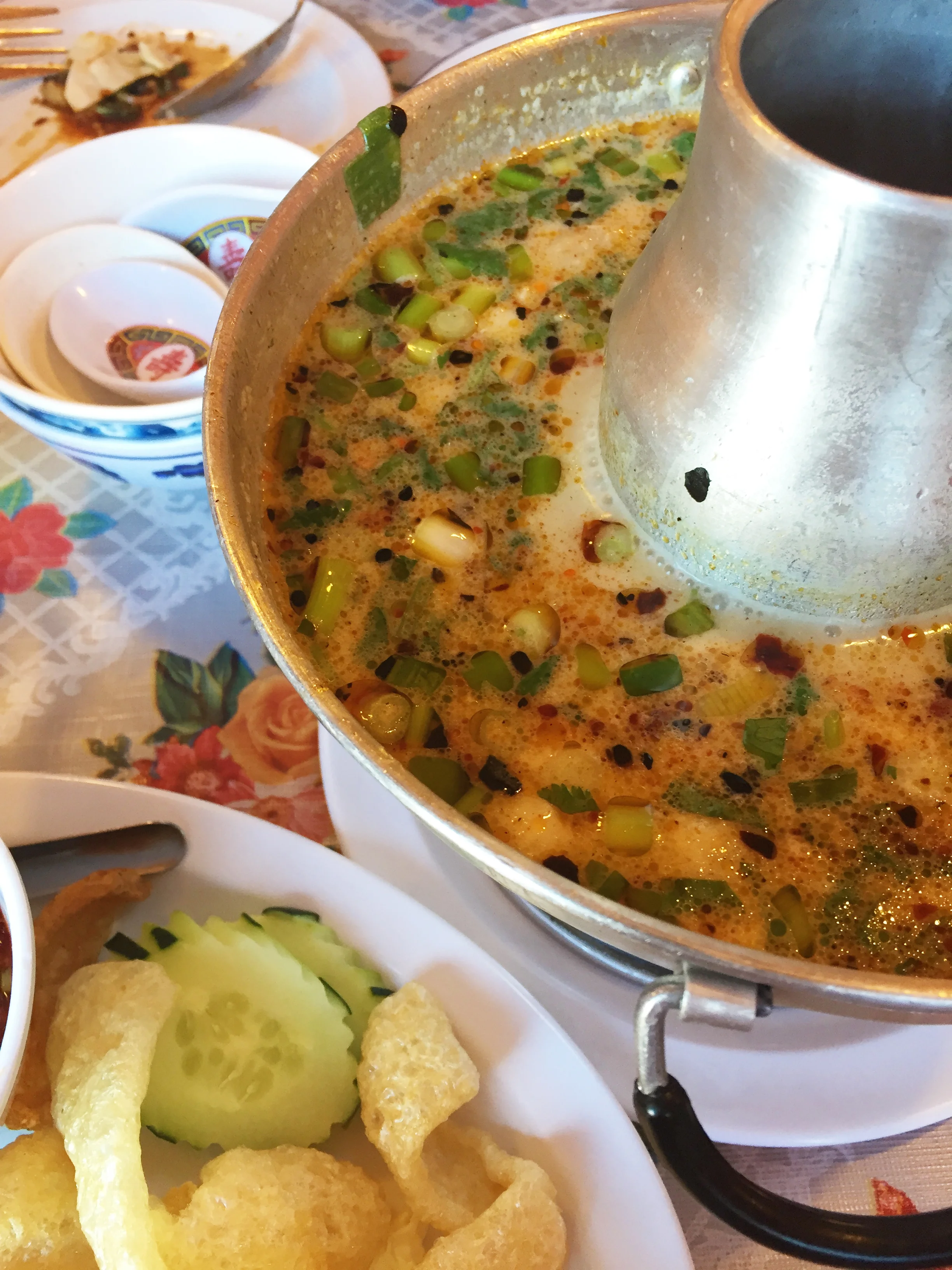 Tom Khar Gai Hot Pot - skin-on chicken, coconut milk broth, galangal, lemongrass, cilantro, onion, chile, lime leaves, and oyster mushrooms.