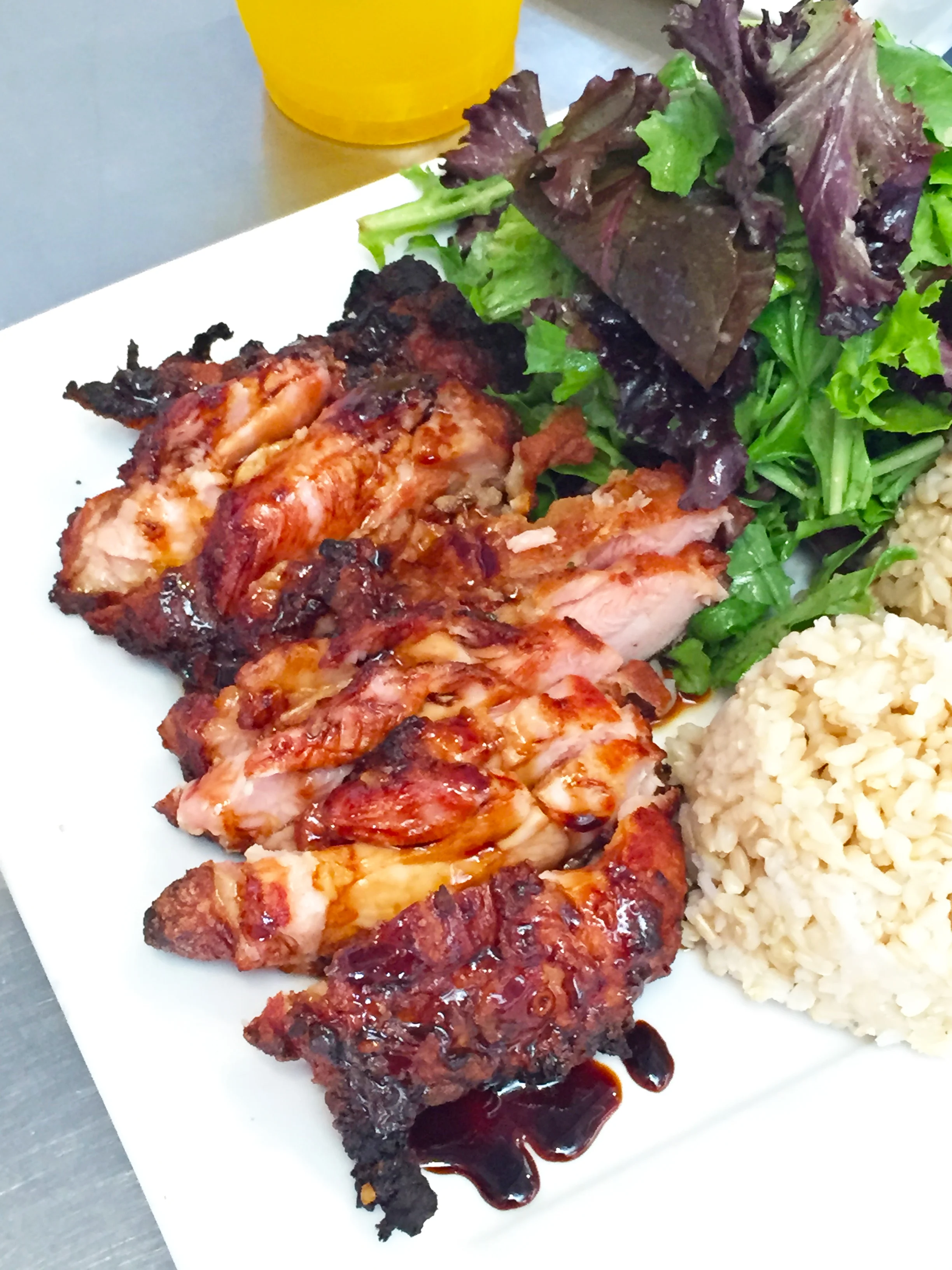 Mochiko Fried Chicken - Hawaiian-style chicken marinated in a homemade wet batter, fried then oven baked. Served with salad and brown rice.