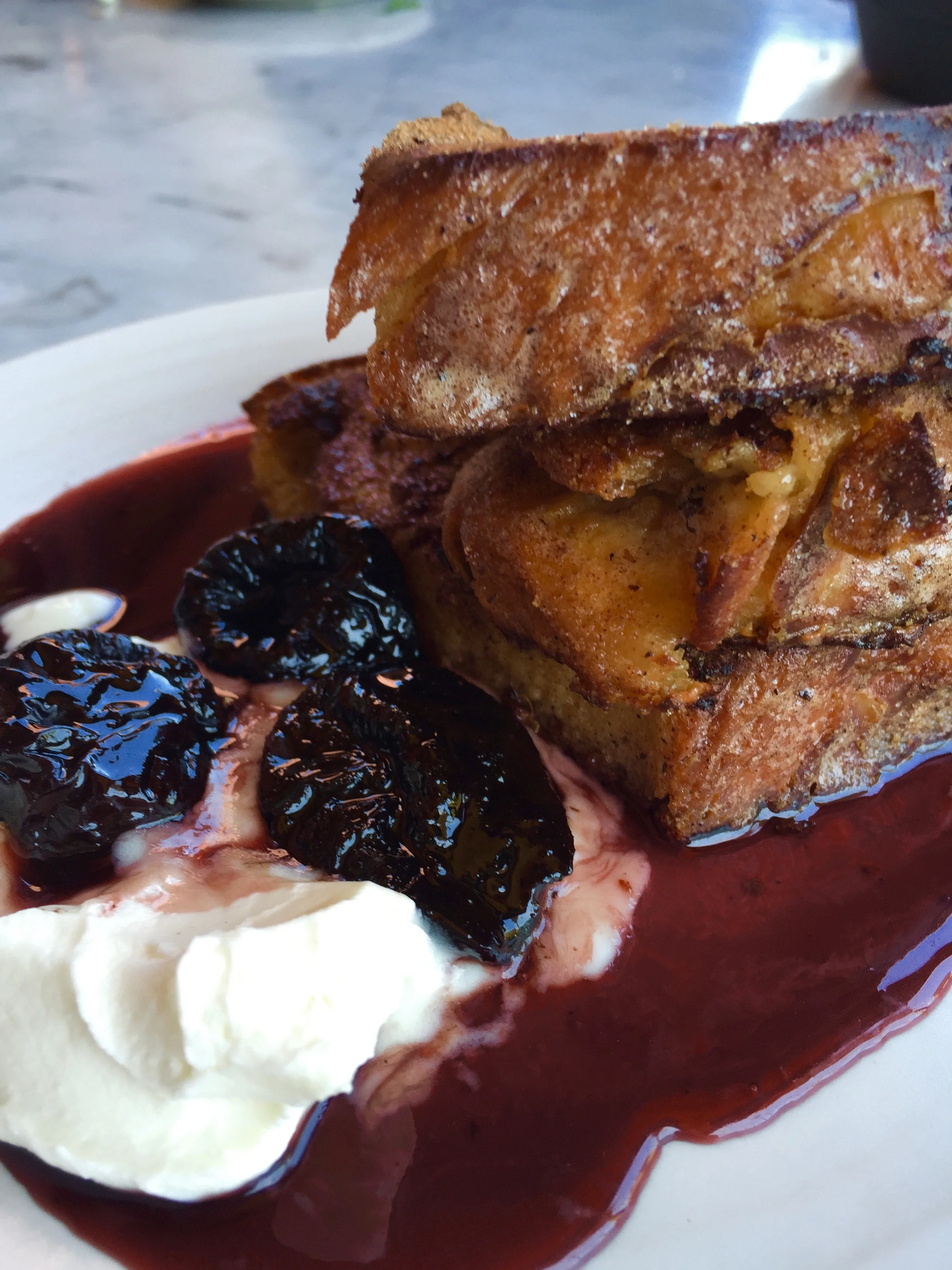 Challah French toast, mascarpone, and warm prunes.