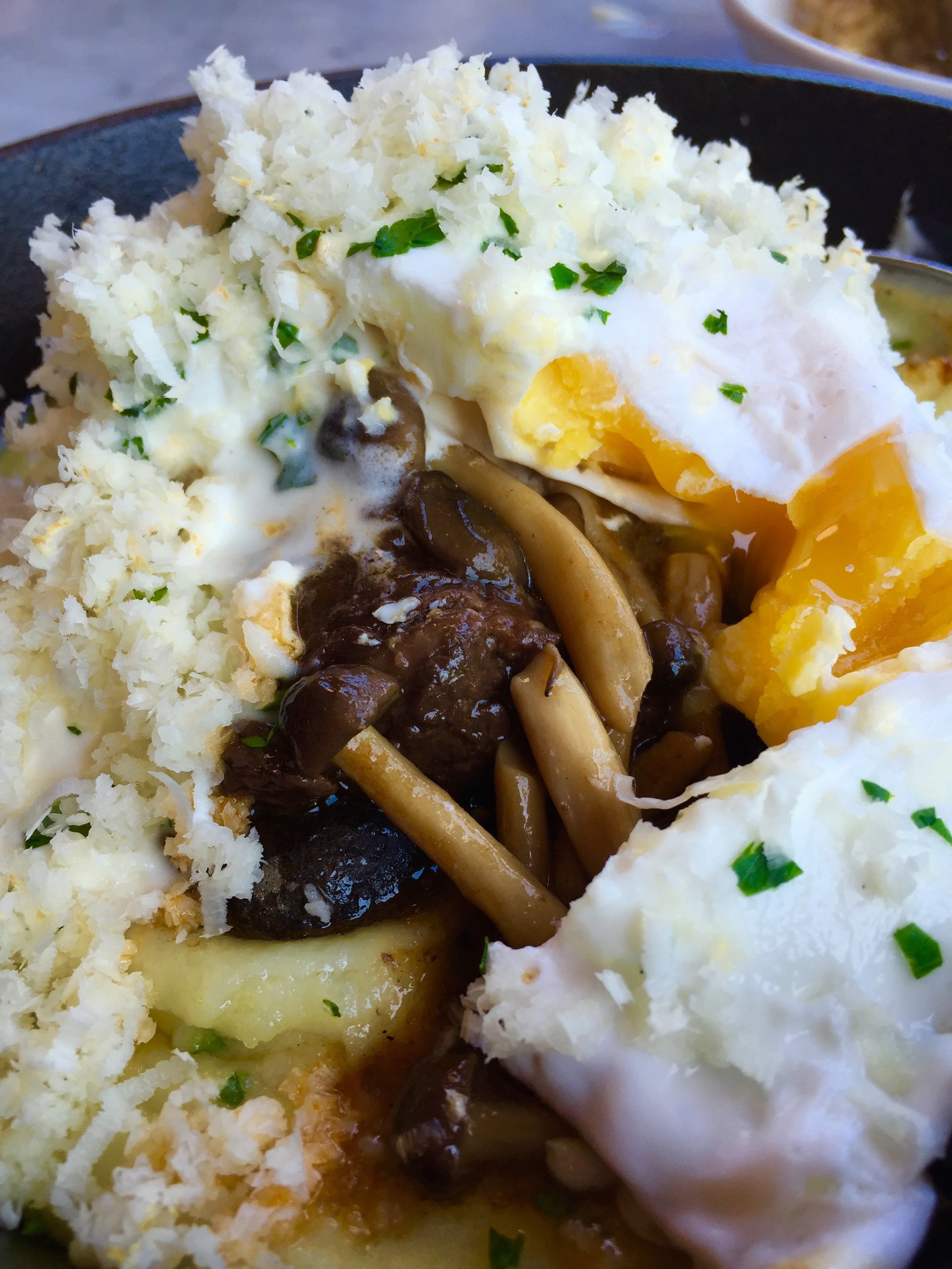 Short rib, salted potato, poached egg, crème fraîche, and horseradish.