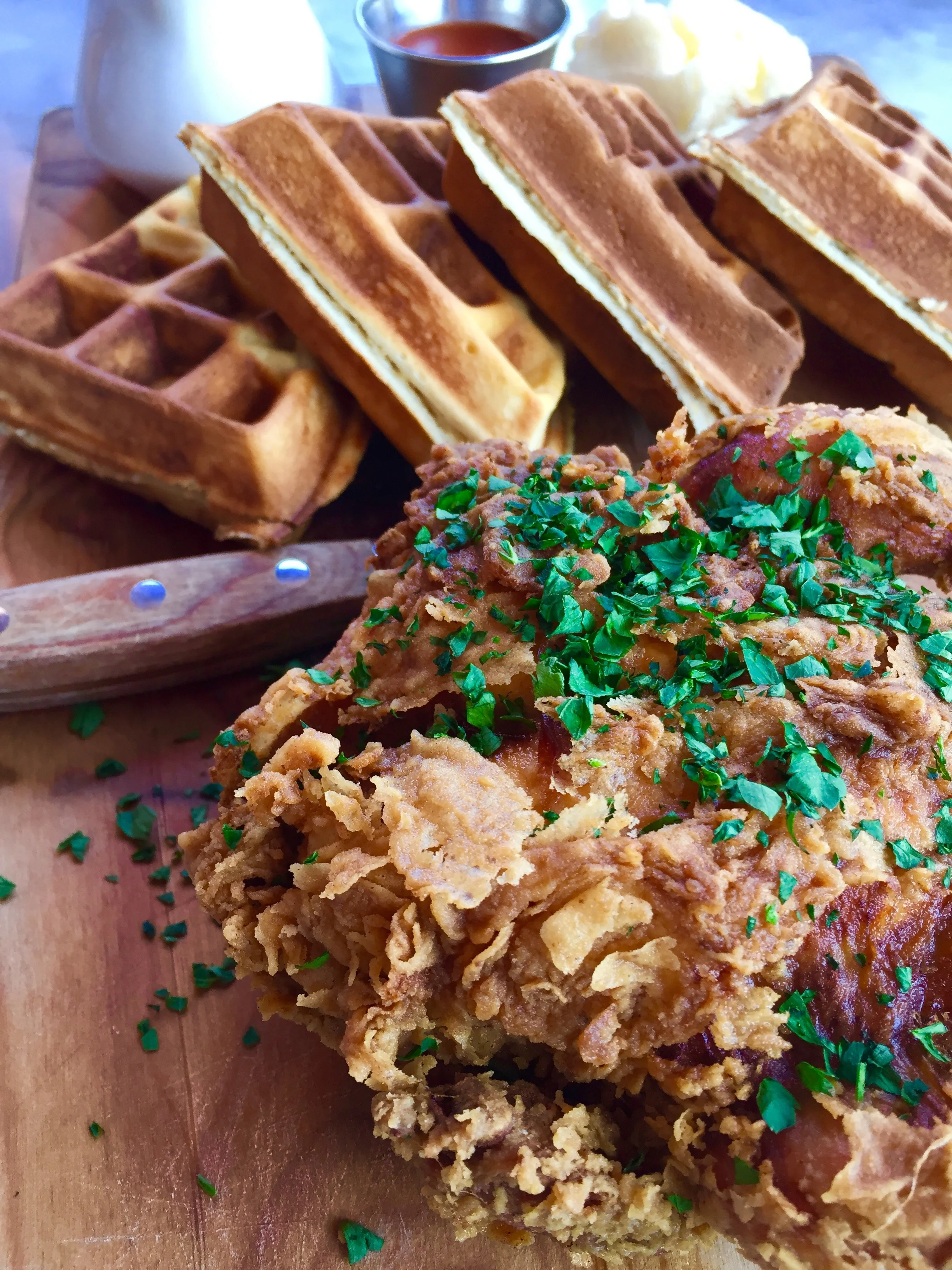 Fried chicken and waffle with maple syrup.