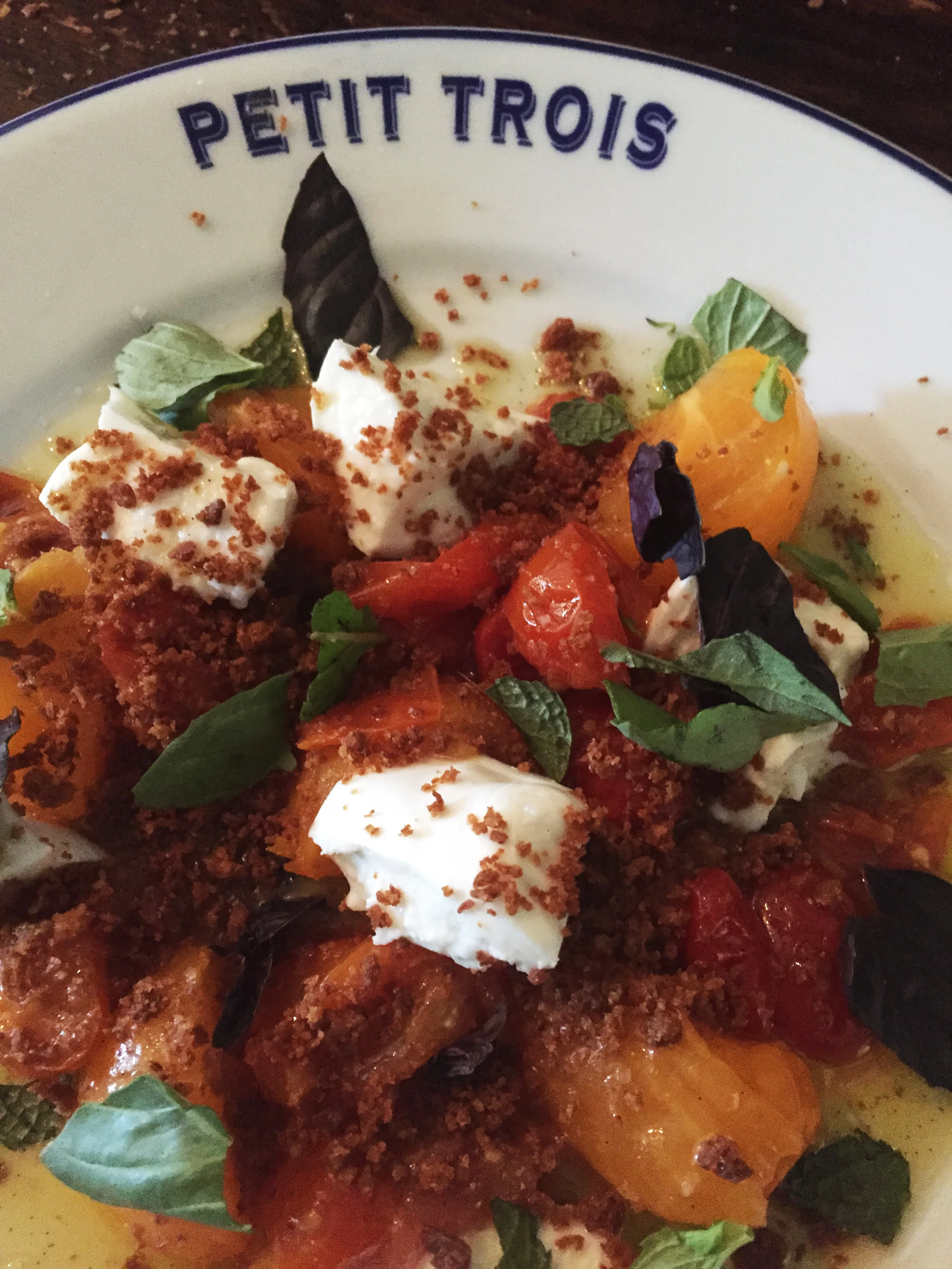 Summer heirloom tomato salad with buffalo mozzarella and lemon verbena.