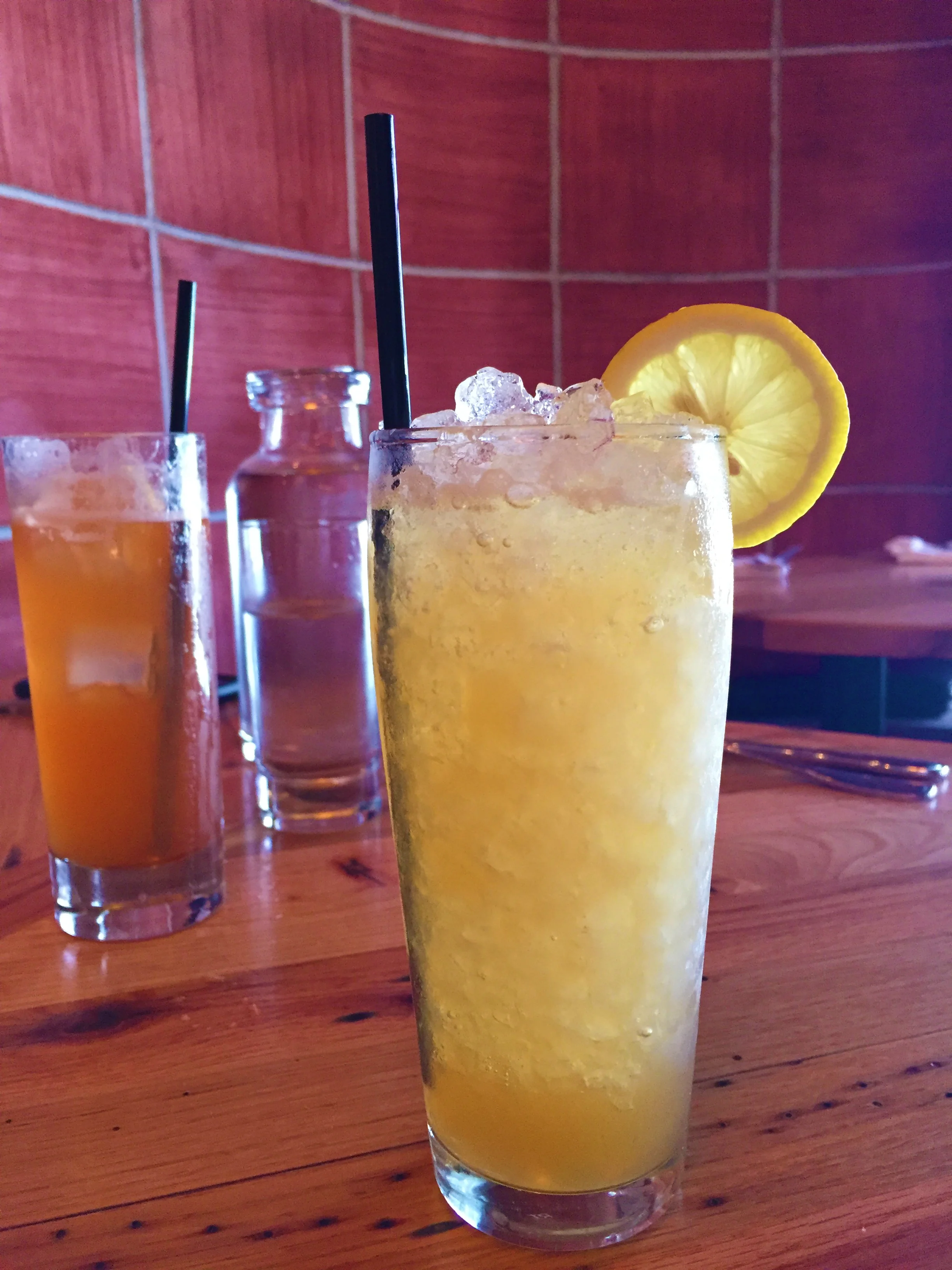 Left: Horse's Neck with bourbon, ginger ale, angostura, and lemon. Right : Lynchburg Lemonade with George Dickel Tennessee Whiskey, lemon juice, honey, and allspice dram.