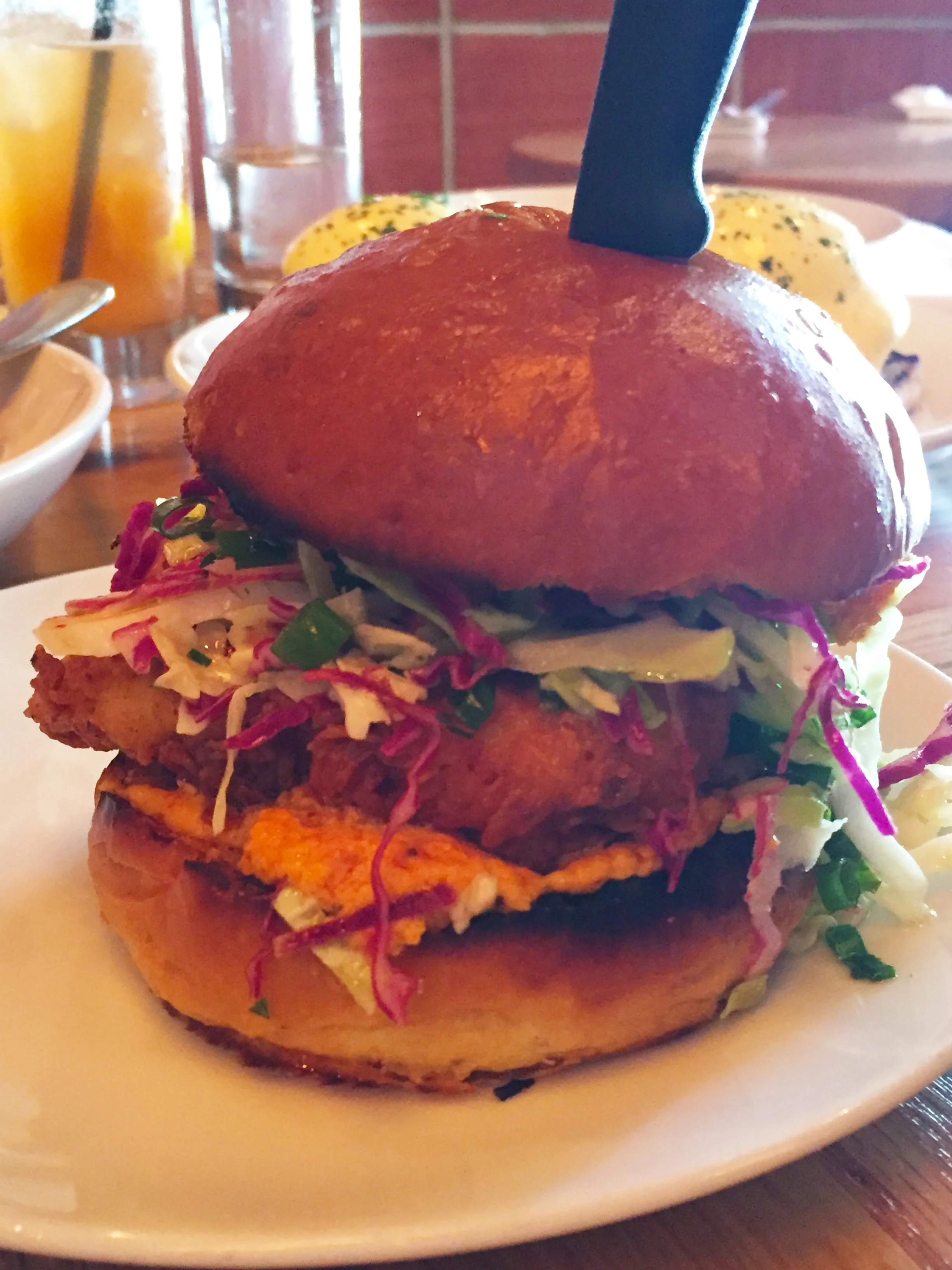 The Best Damn Chick'n Sandwich Ya Ever Had with pimento cheese, jalapeño, and cole slaw on a milk roll.