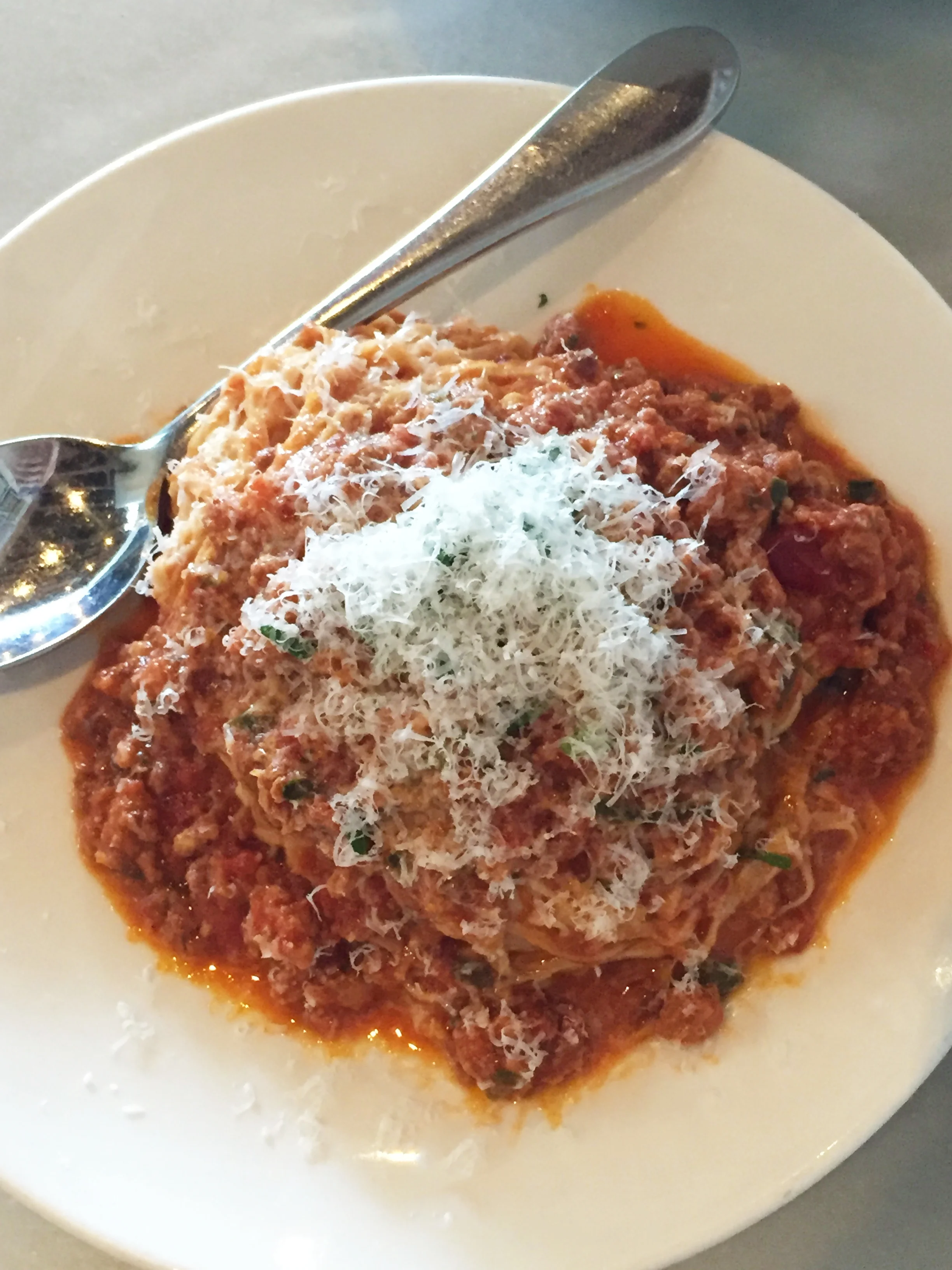 Fresh Tagliarini Bolognese with clover cream, parsley, and parmesan.