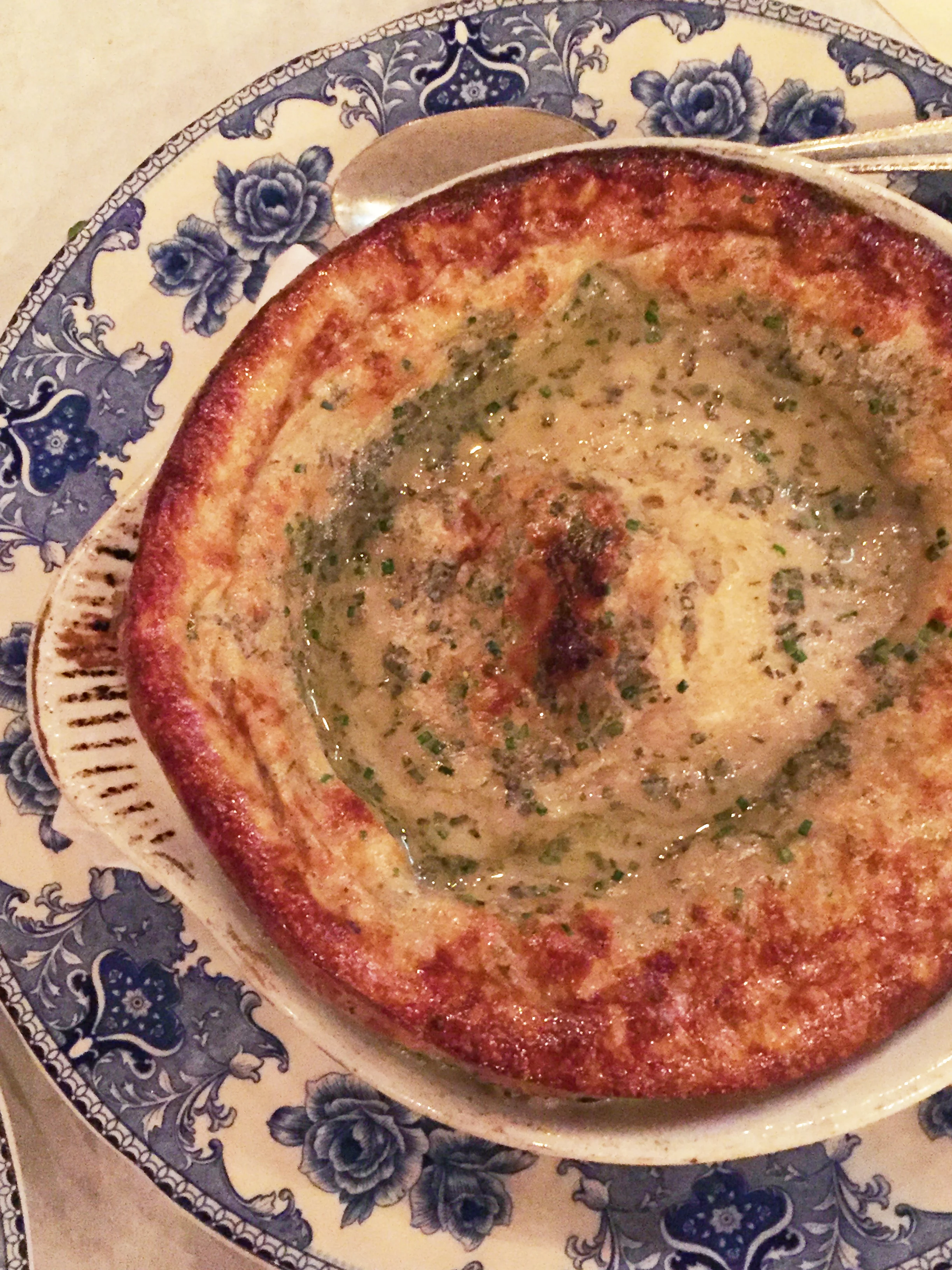 Duck Yorkshire Pudding with duck fat, sage, and chives.