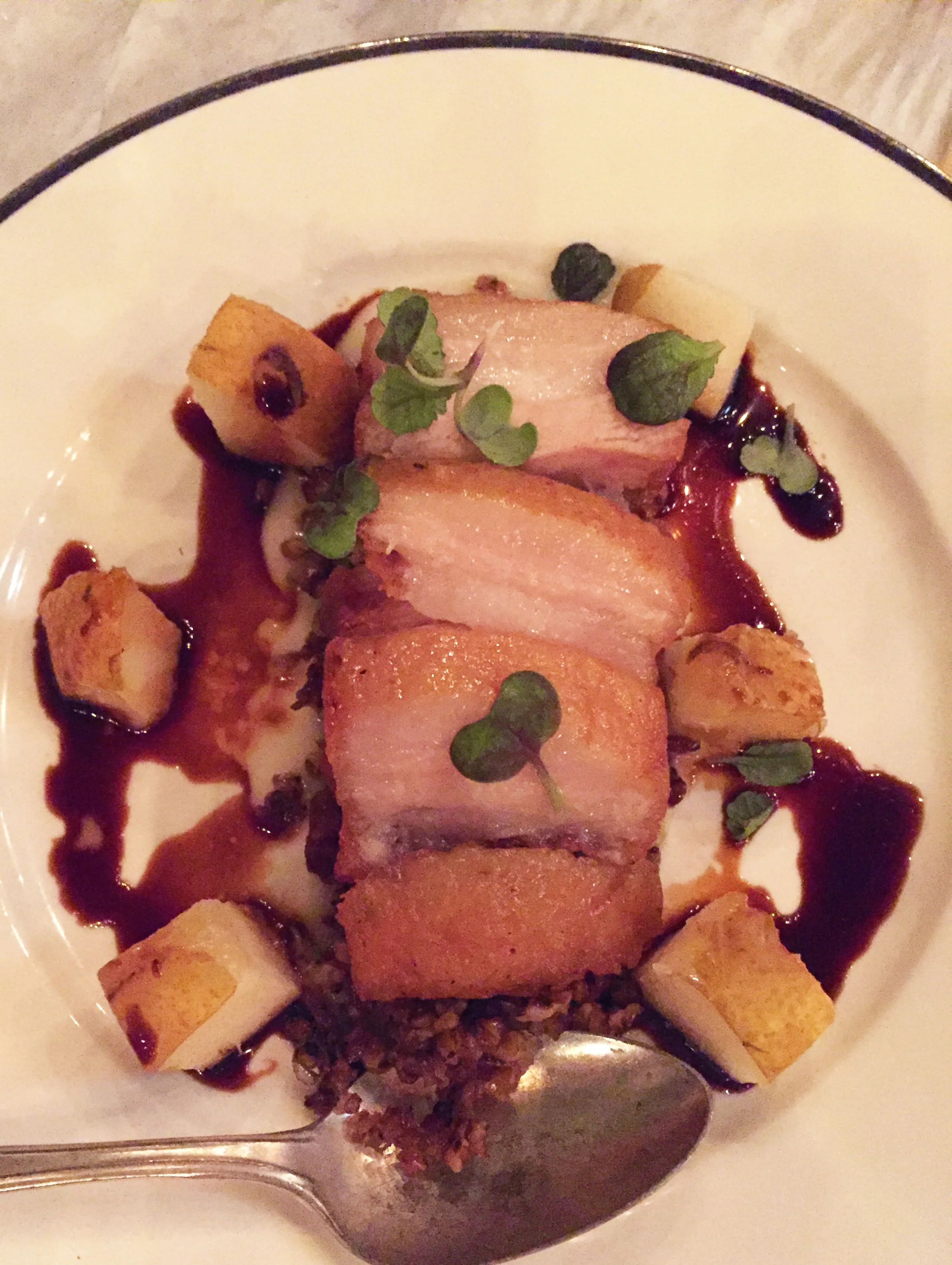 Crispy Pork Belly with pears, faro, black vinegar, and apricot mostarda.