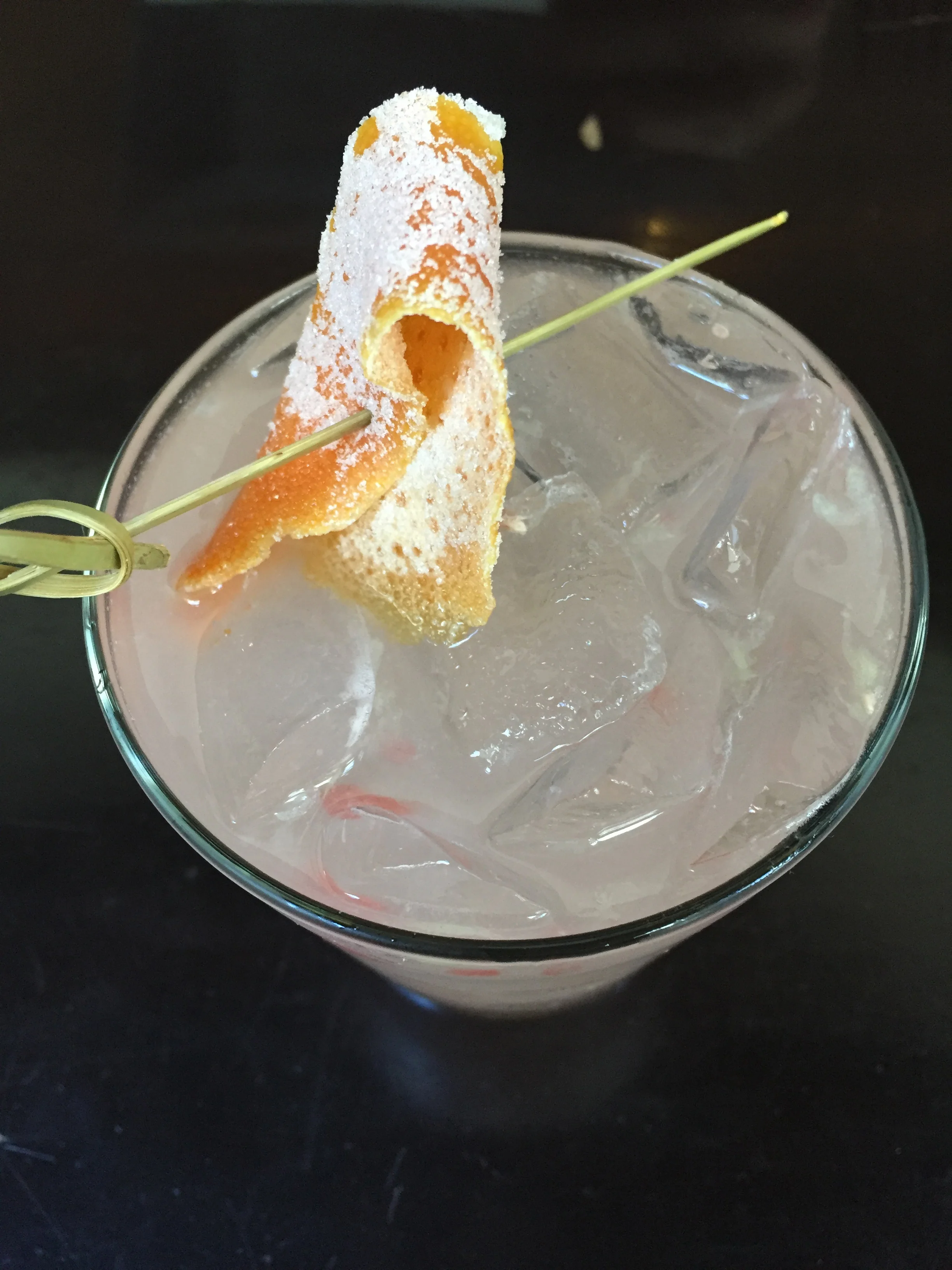 Greyhound Proper with Plymouth Gin, grapefruit, and candied grapefruit peel.