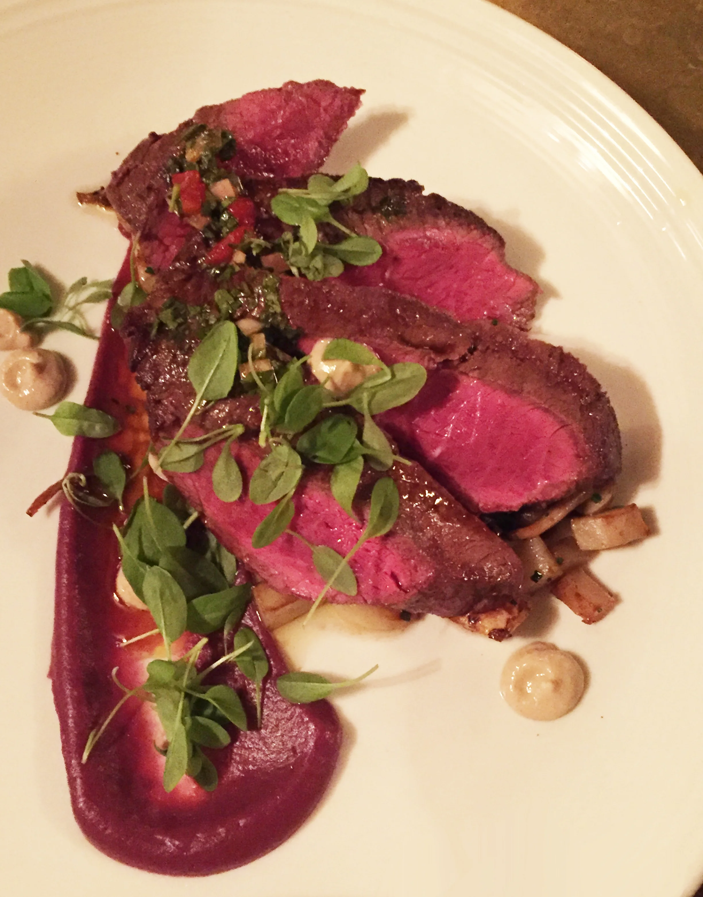 Marinated Flat Iron Steak with red cabbage puree and sunchokes.