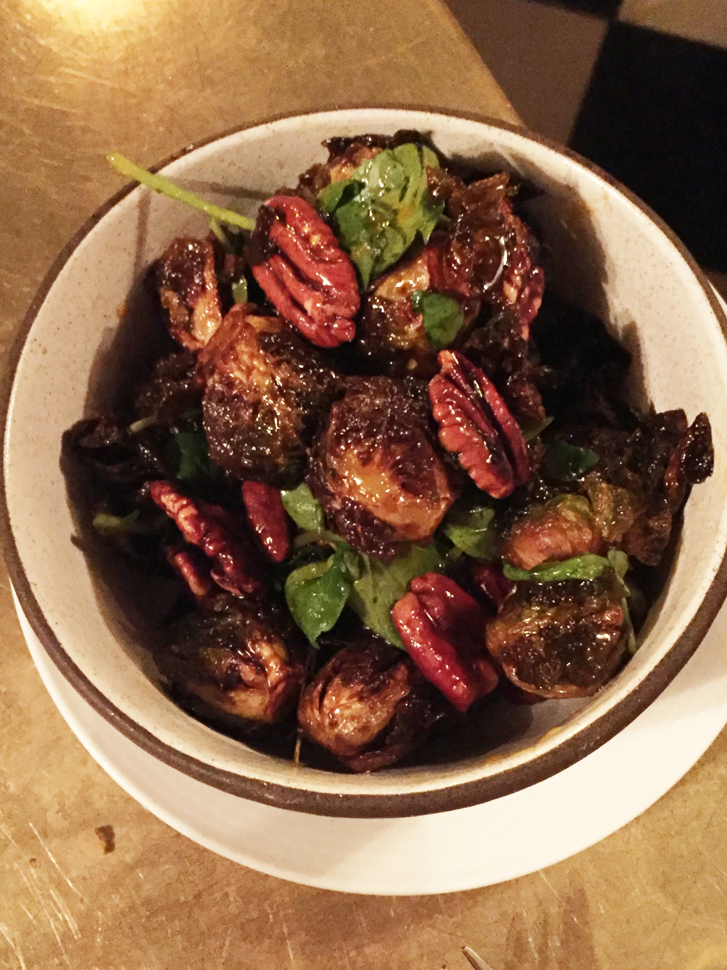 Sweet & spicy brussels sprouts with gram, pecans, and garlic confit.