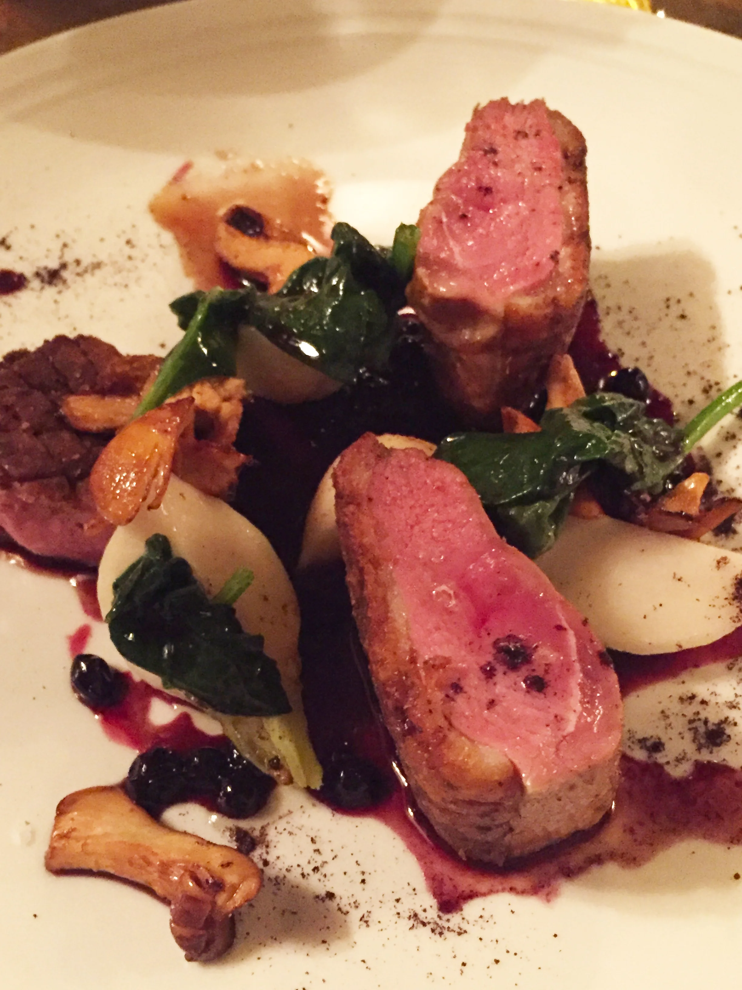 Liquorish Rubbed Duck Breast with Tokyo turnips, chanterelles, and huckleberry jus.