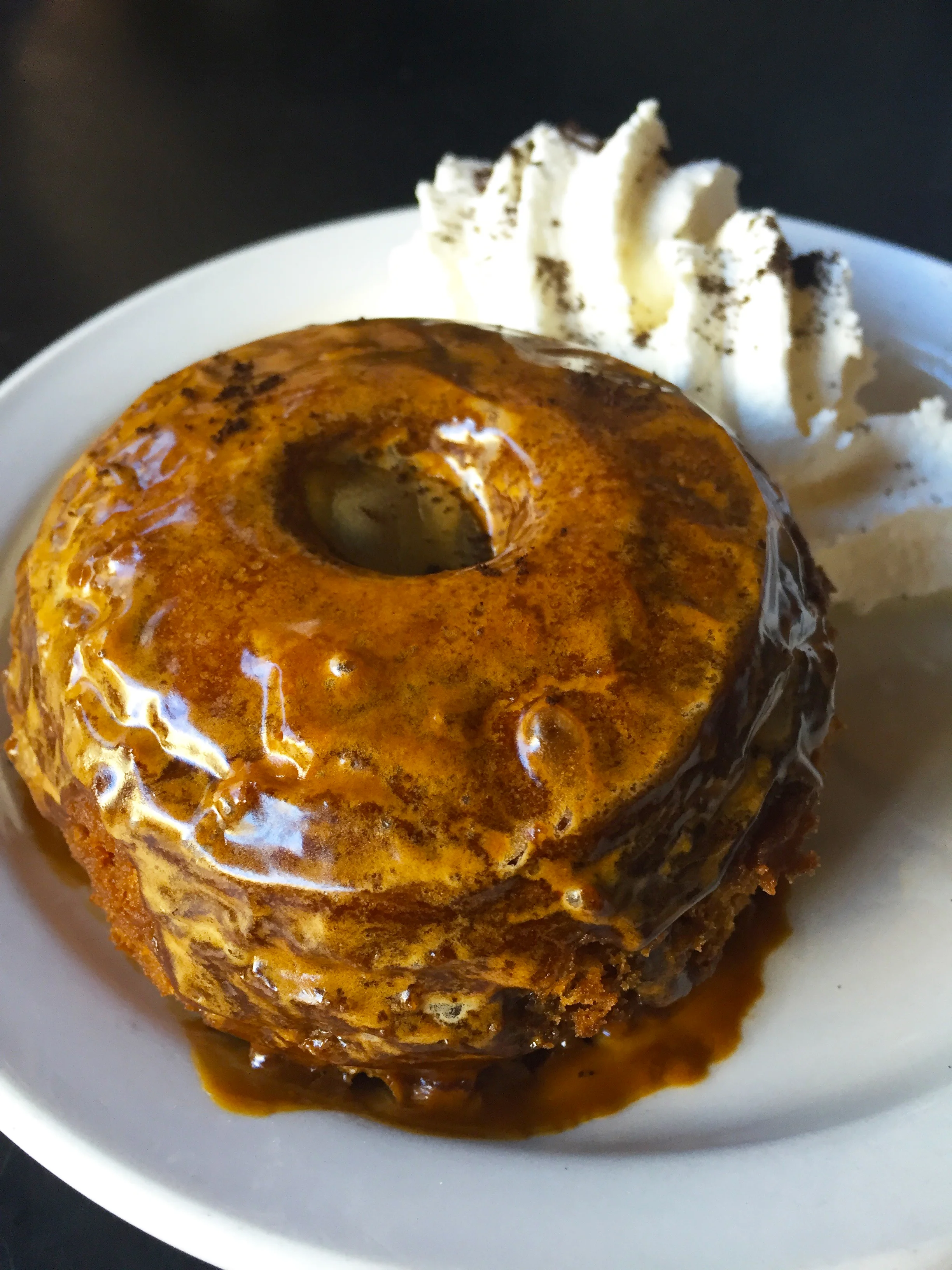Old Fashioned Maple Donut with espresso glaze, and spiked whipped cream.
