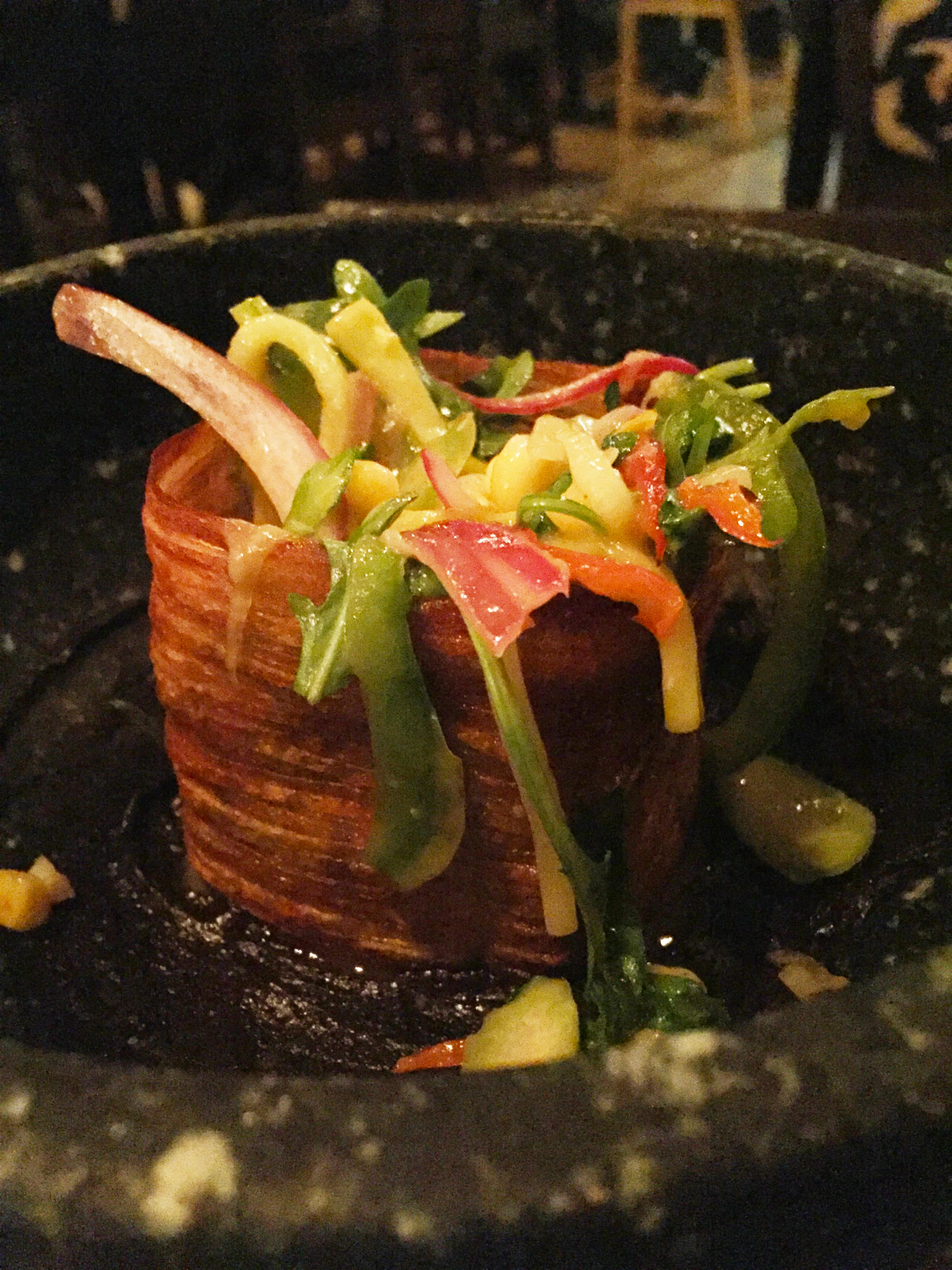 Vegetables in a Box - a base of puréed charred Japanese eggplant, enclosed in a deep-fried Yukon Gold potato "box," garnished with chef's choice of seasonal vegetables, arugula, and sea salt.