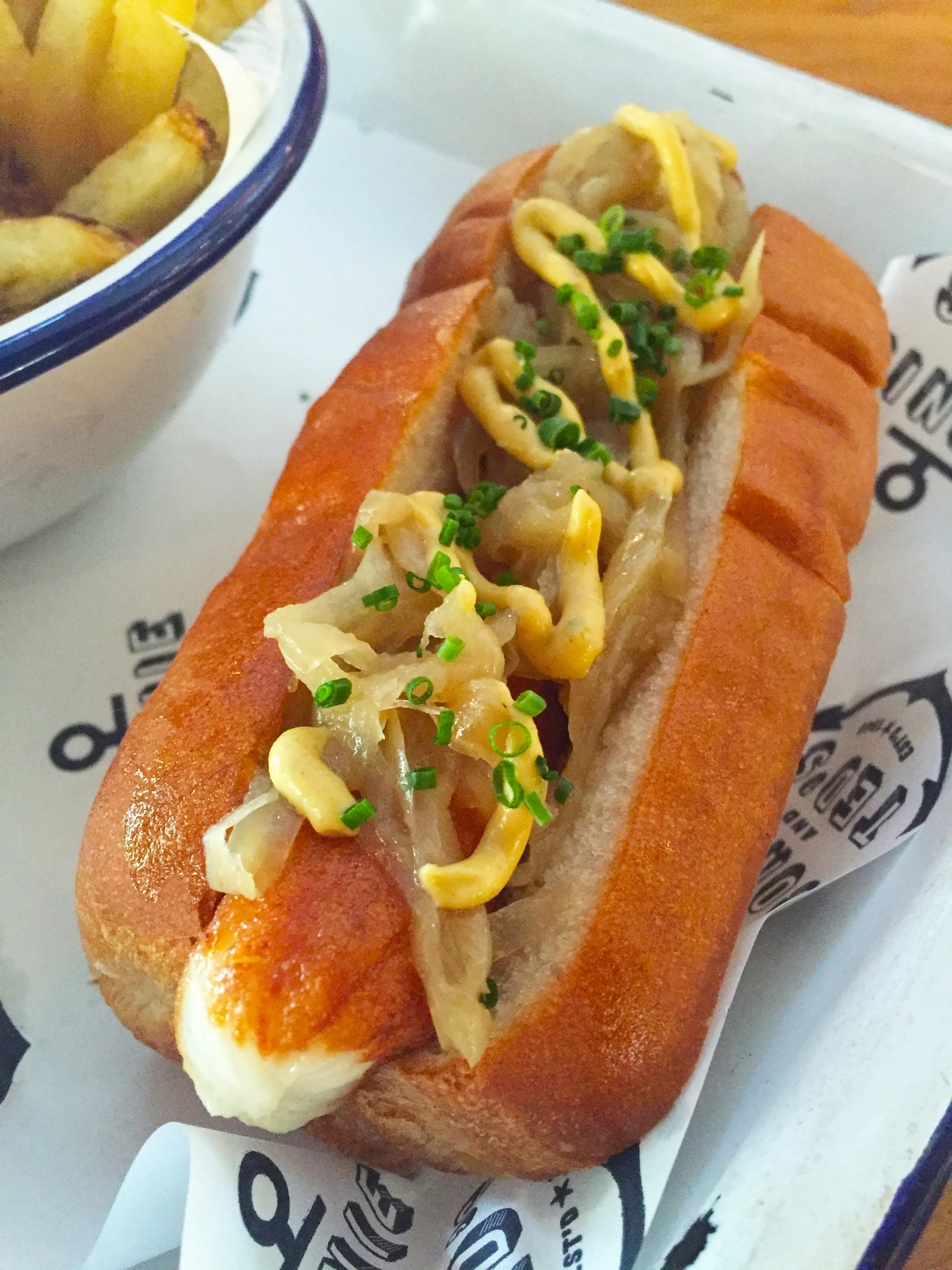 Hokkaido Dog with Hokkaido scallop sausage, onions, and smoked mustard