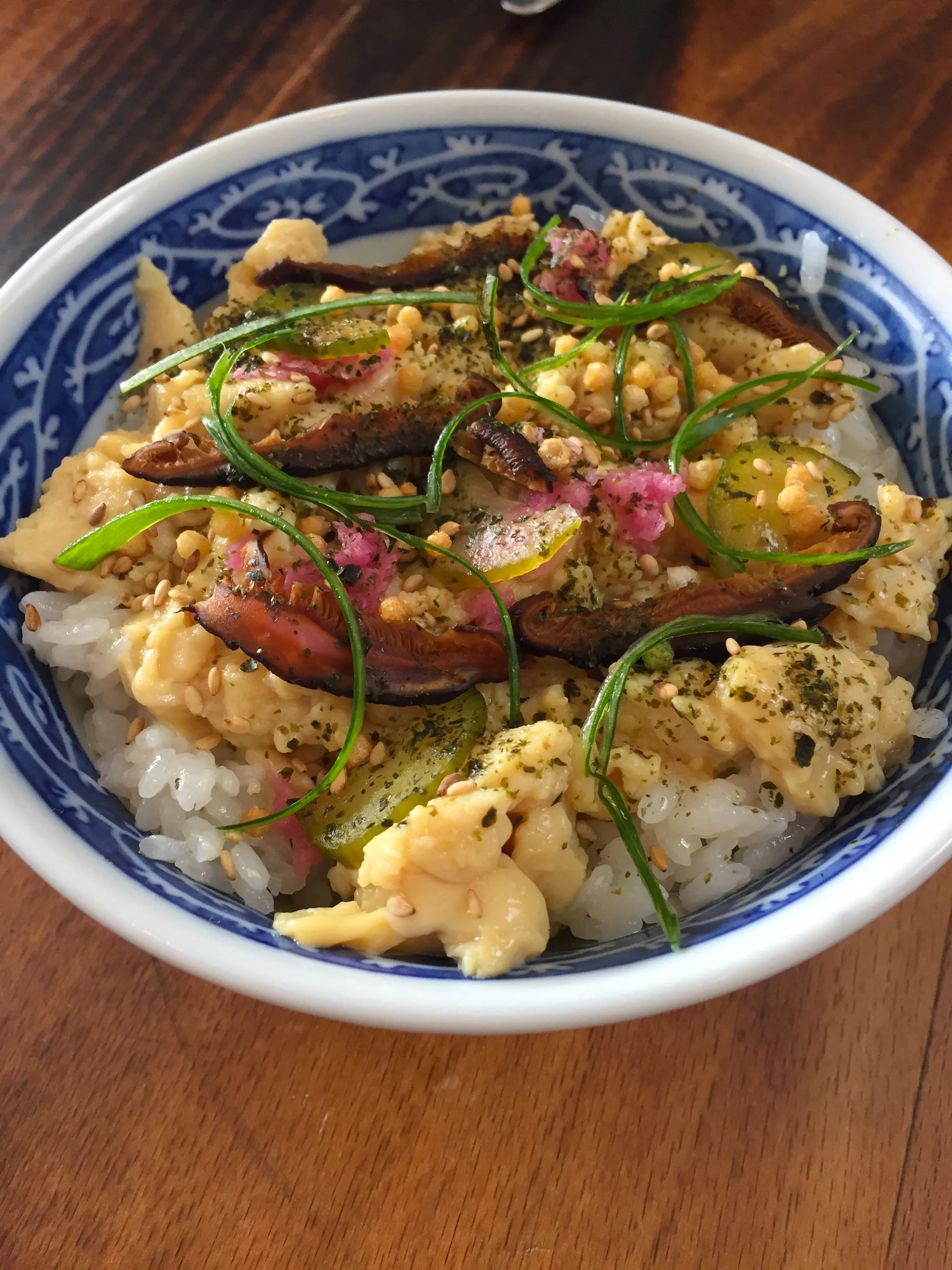 "Tamago" Scramble with bone marrow sushi rice, Japanese pickles, and arare.
