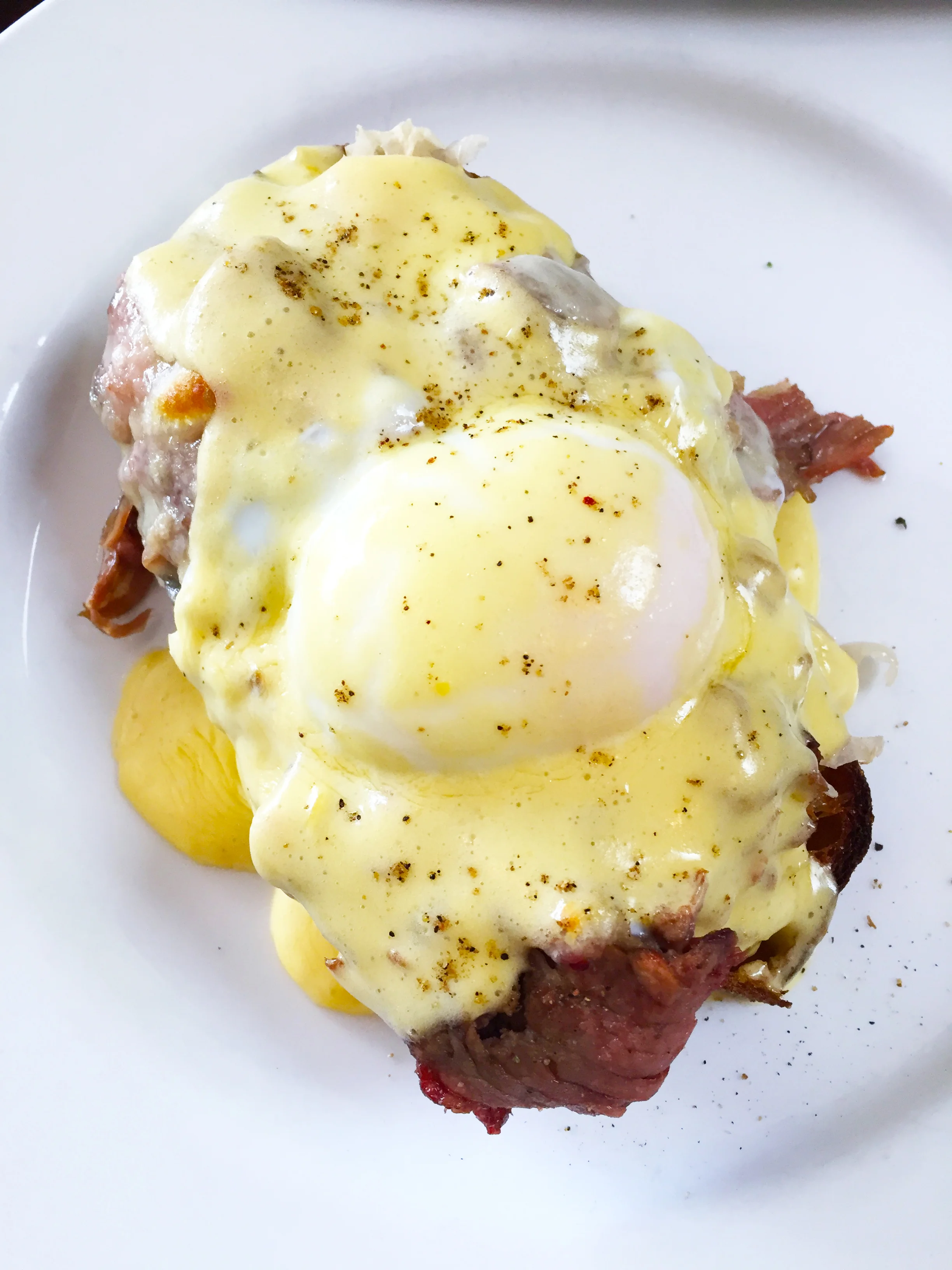 Pastrami reuben benedict on rye with sauerkraut, hollandaise, and 1K island sauce.