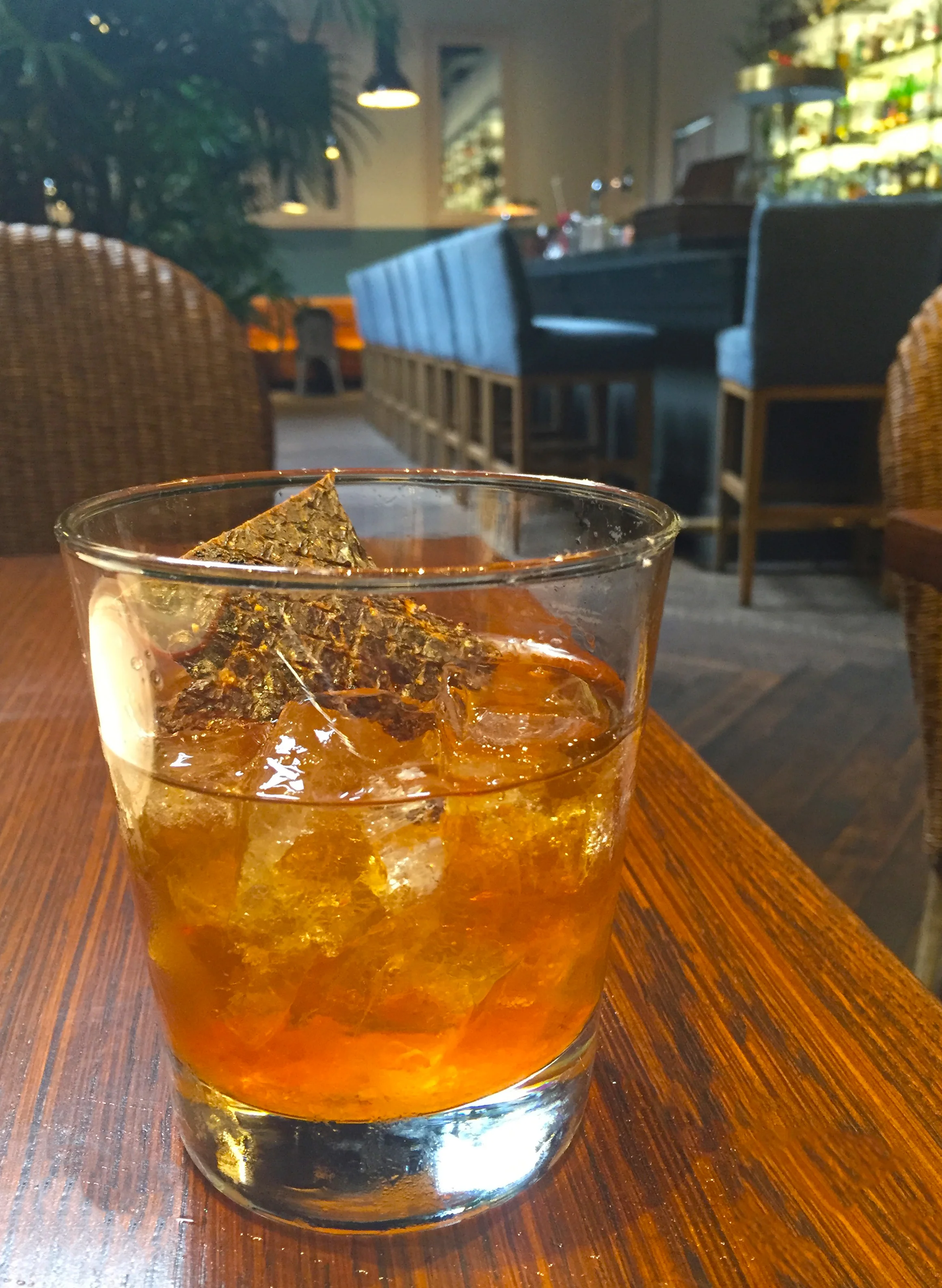 BBQ Old Fashioned with Balcones "Baby Blue" bourbon, brown sugar, smoked BBQ bitters, and Belcampo Meat Co. beef jerky