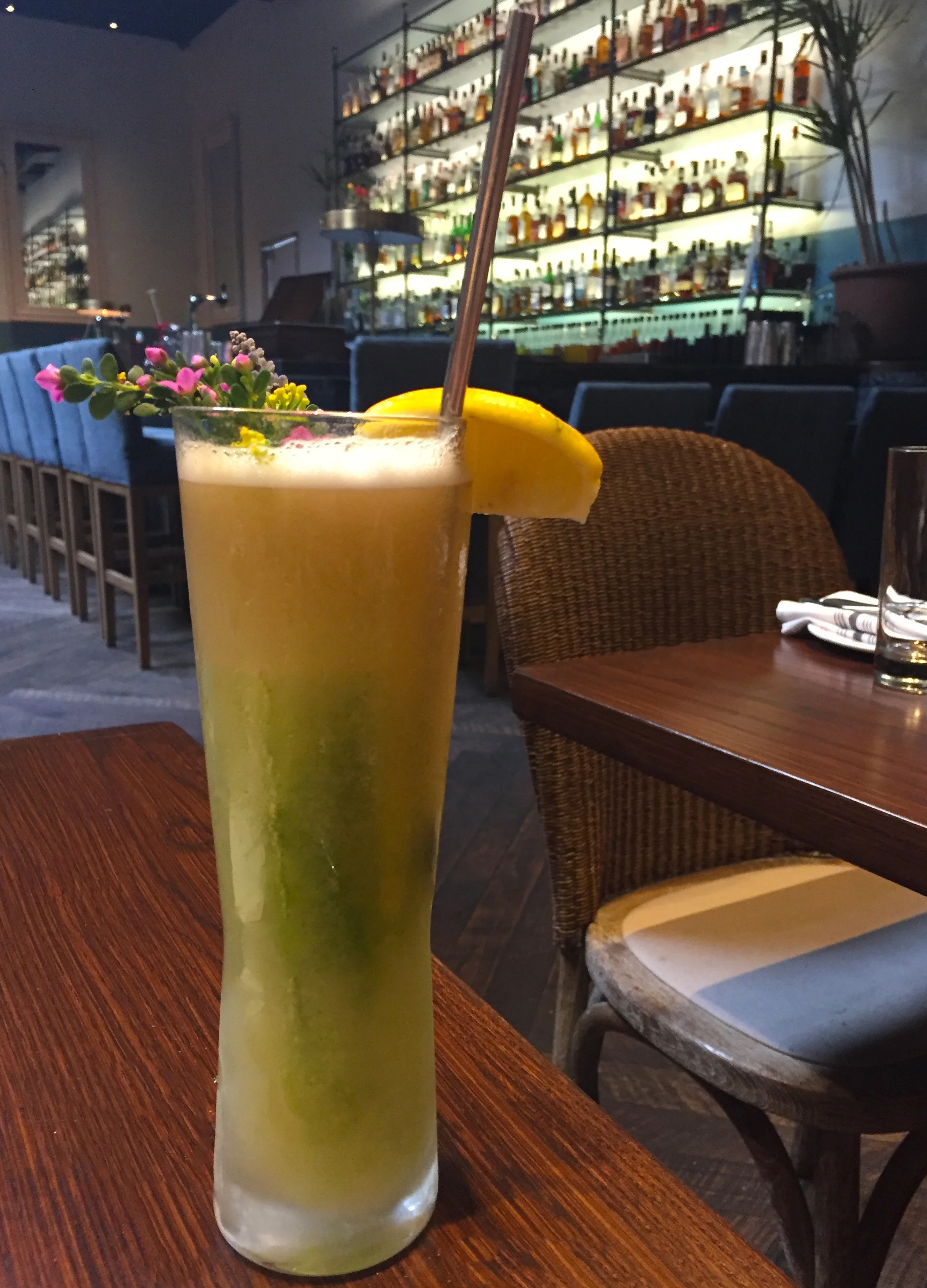 House Bloody Mary with cracked bell pepper vodka, clarified tomato juice, lemon juice, and celery ice cube.