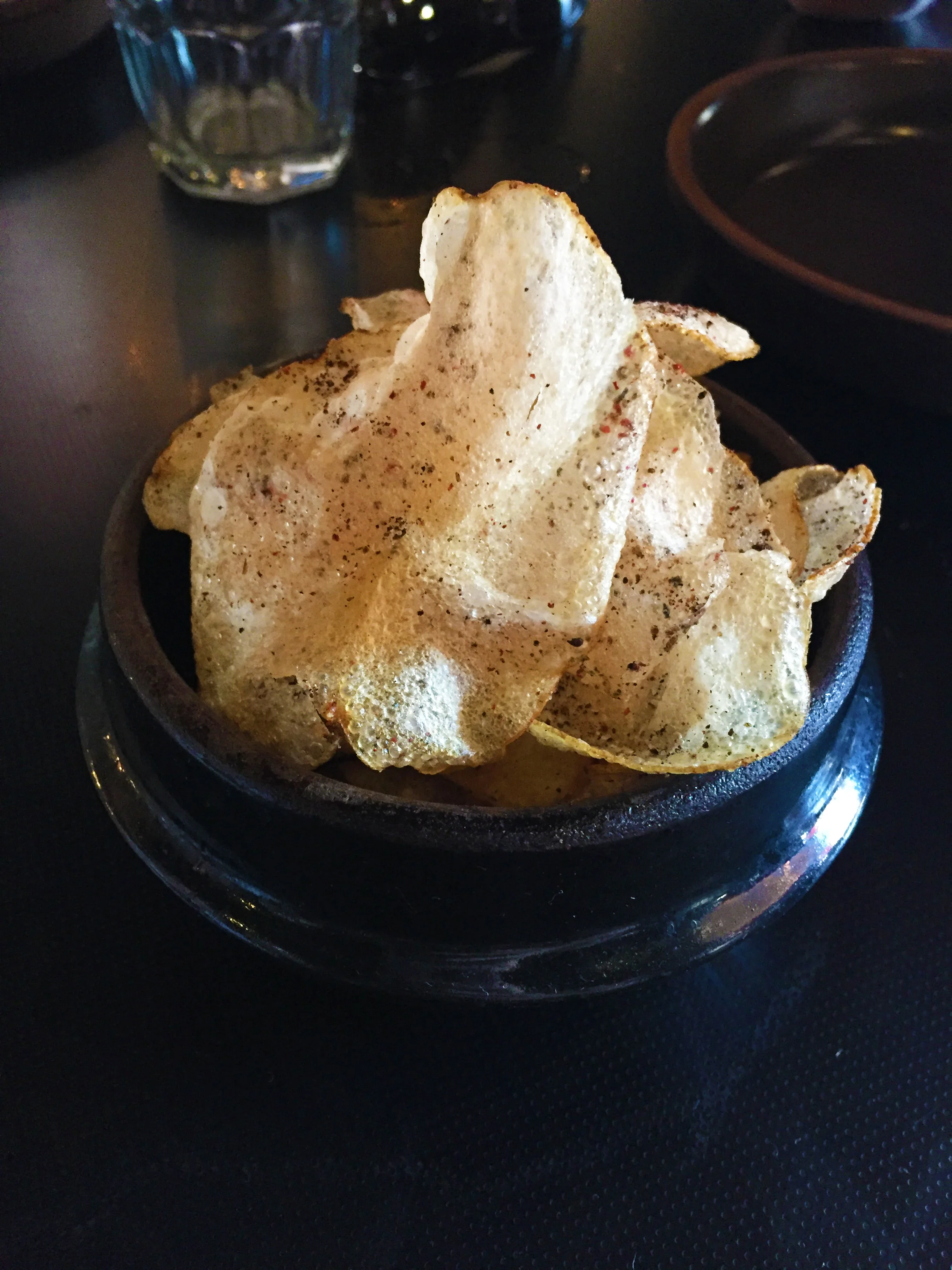 Potato Chips with pink peppercorn and burnt onion.