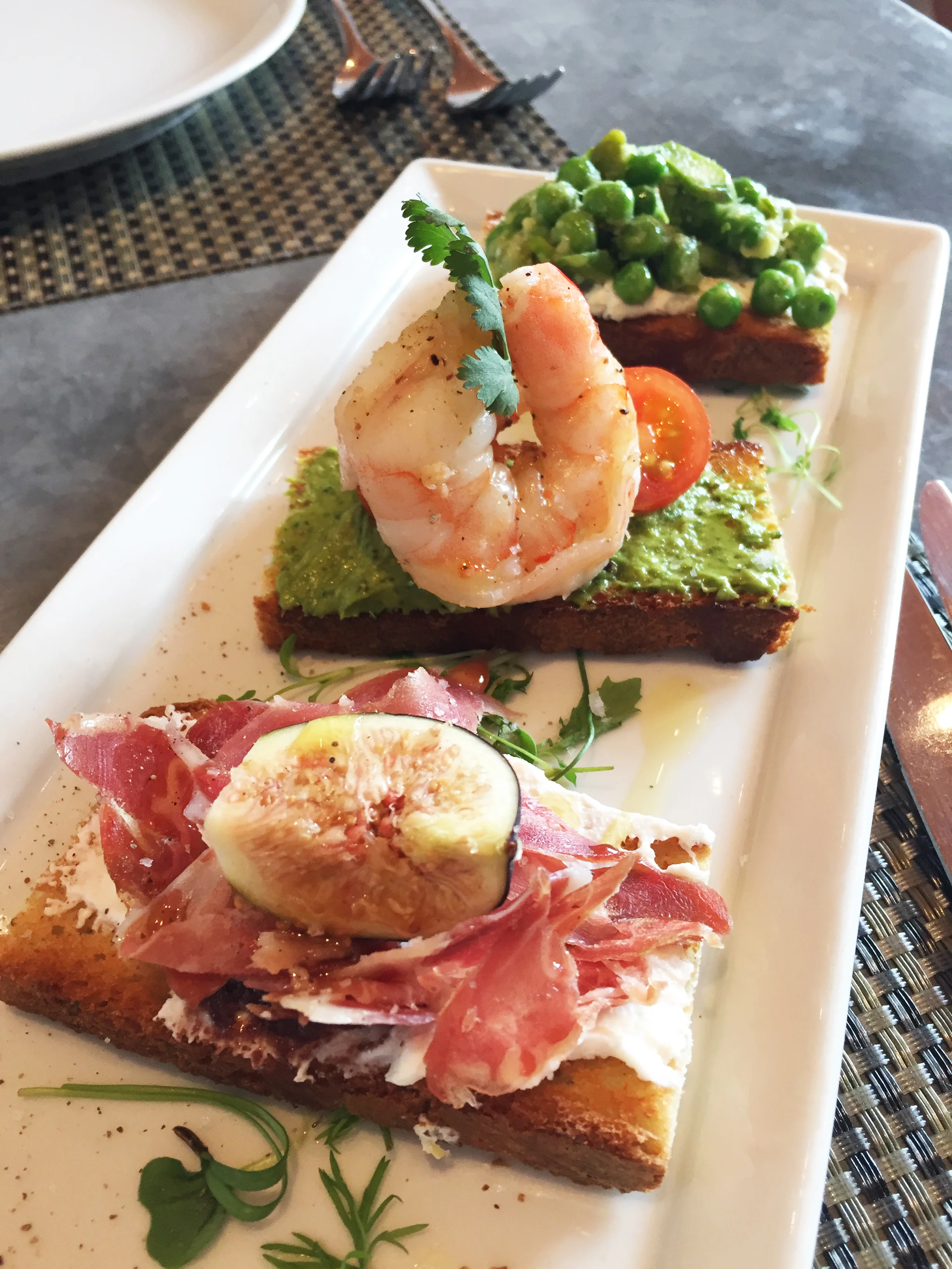 Crostini (front to back) : Prosciutto | ricotta, fig, olive, walnut Shrimp | avocado, cilantro, tomato Pea | asparagus, ricotta lemon thyme