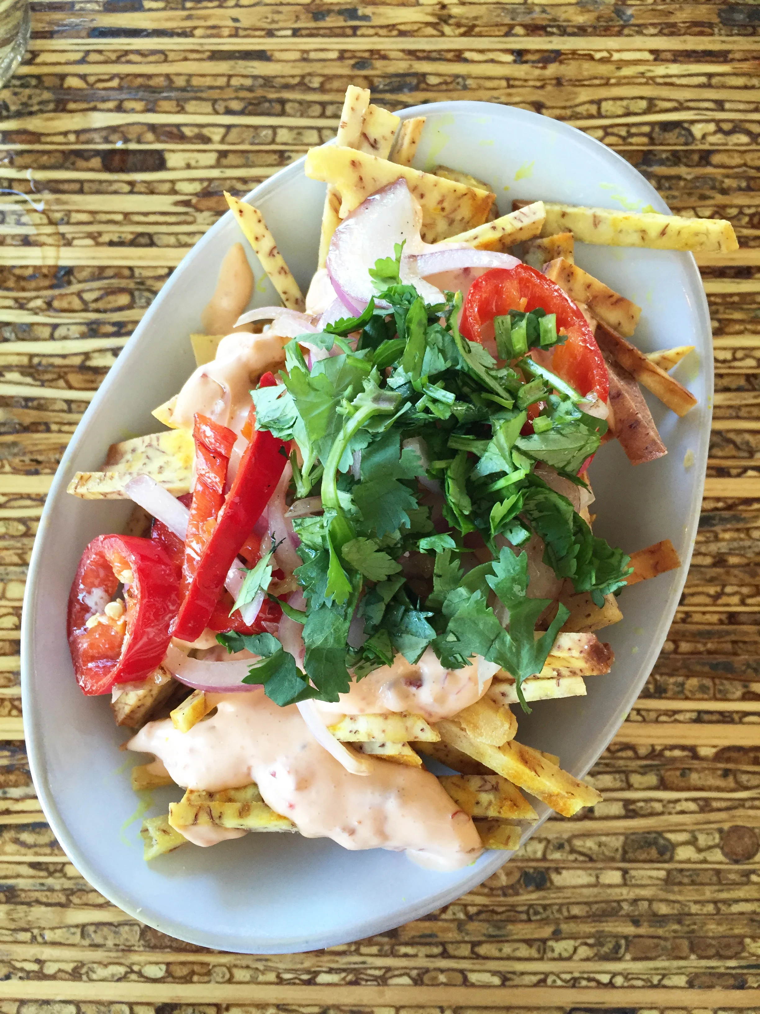 Animal Fries - Taro fries with grilled onion, chilies, aioli, cilantro and shallots.